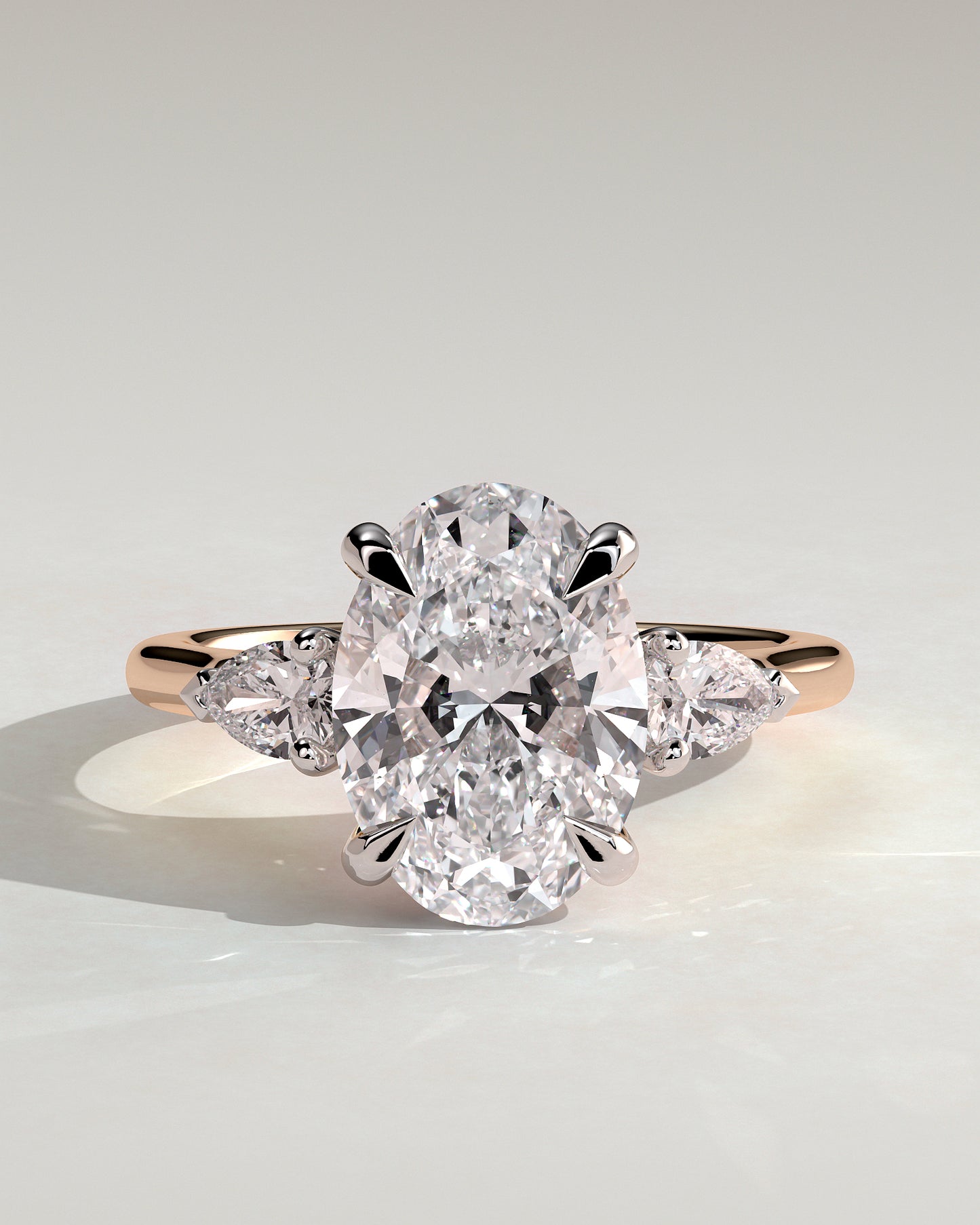 Alexia - Oval Claw Trilogy with Pear Side Stones and Cathedral Setting Engagement Ring - Rose Two-Tone