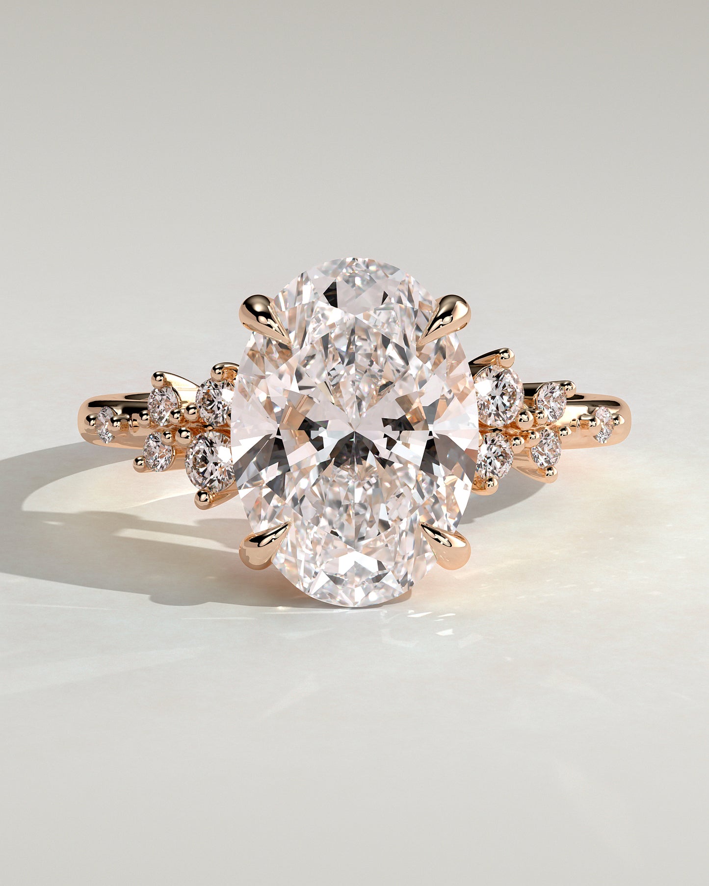 Bella - Oval Claw Solitaire with Clustered Round Shoulder Stones Engagement Ring - Rose Gold