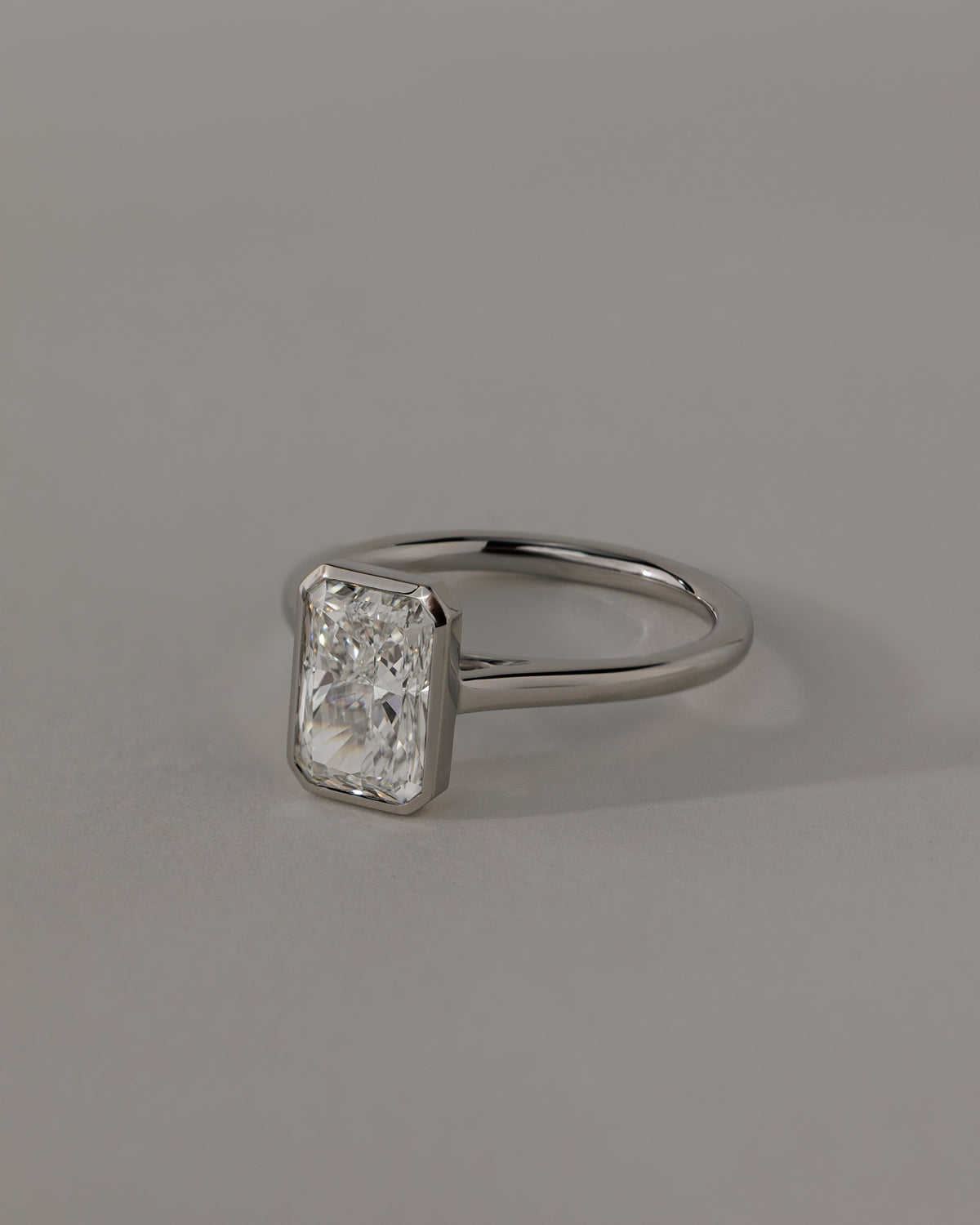 Zoe - Radiant Bezel Solitaire with Open Cathedral High Setting Engagement Ring - Platinum