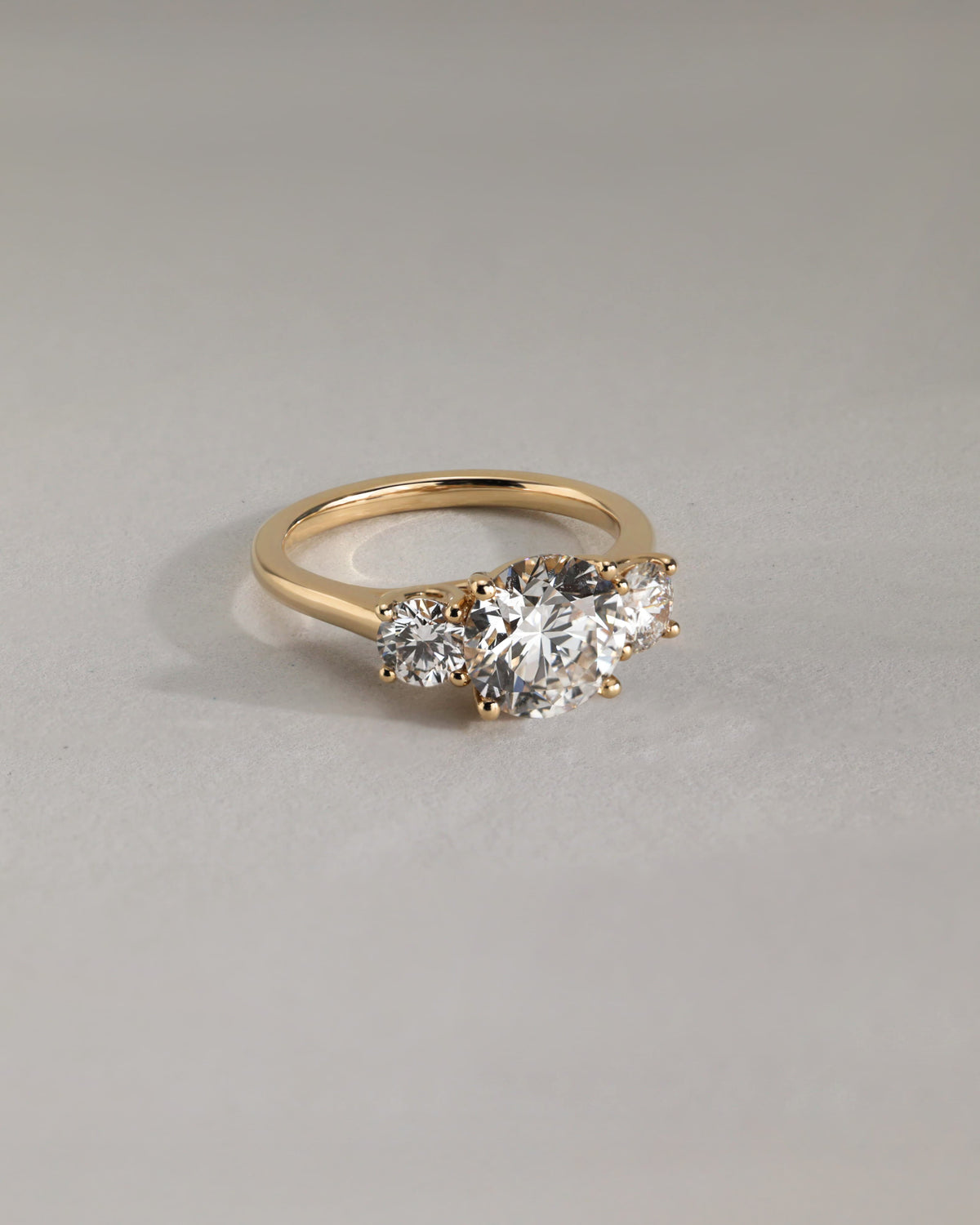 Octavia - Round Claw Trilogy with Round Side Stones and Trellis Gallery Engagement Ring - Rose Gold