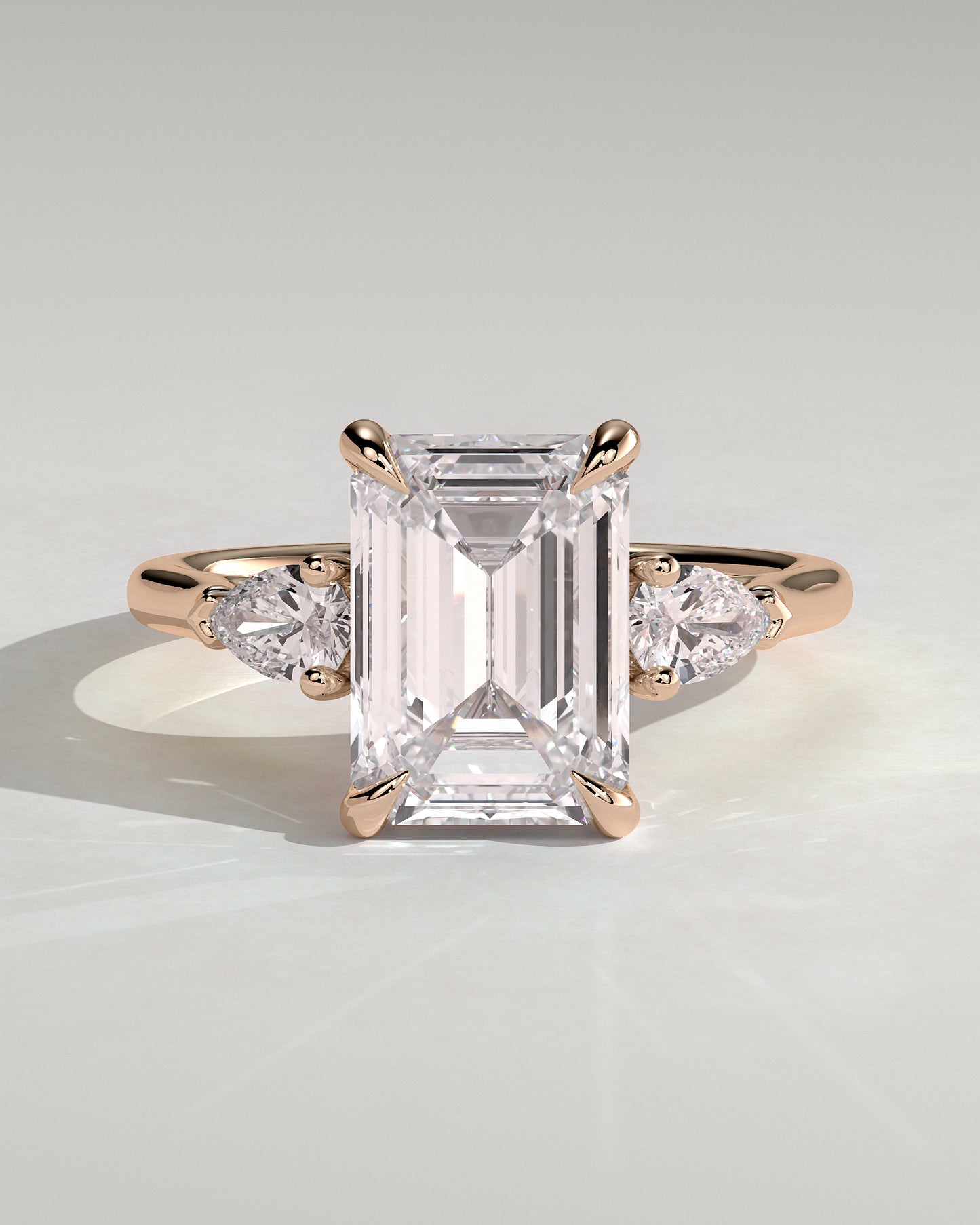 Davina - Emerald Claw Trilogy with Pear Side Stones and Cathedral Setting Engagement Ring - Rose Gold