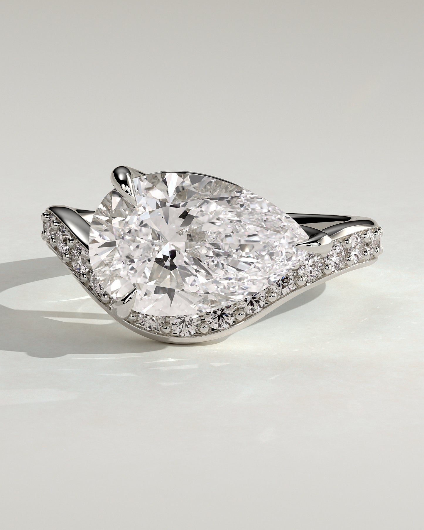 Eliza - Pear Claw Solitaire with Bead Set Pave Wave Band and East West Setting Engagement Ring - Platinum
