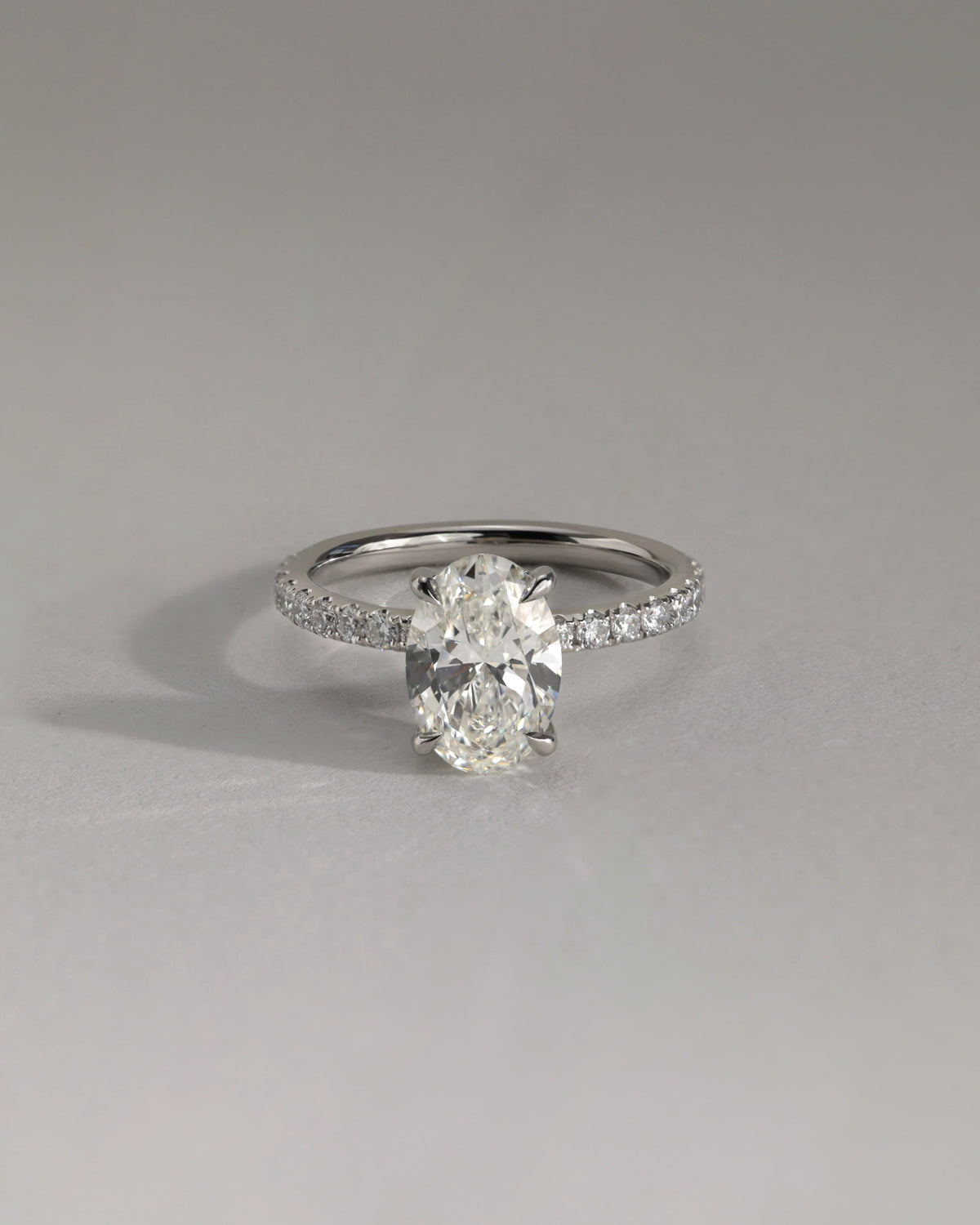 Paige - Oval Claw Solitaire with Hidden Halo and Pave Band Engagement Ring - White Gold
