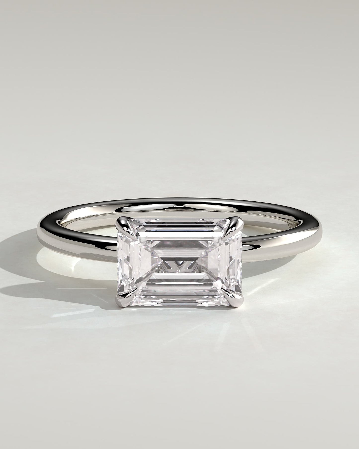 Debbie - Emerald East West Claw Solitaire Engagement Ring - White Gold