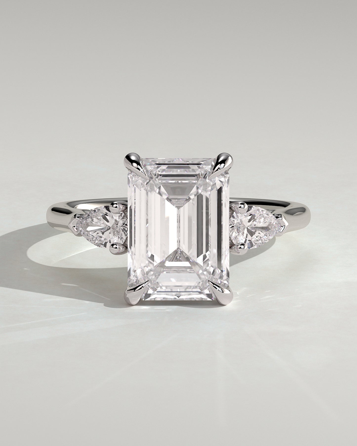 Davina - Emerald Claw Trilogy with Pear Side Stones and Cathedral Setting Engagement Ring - Platinum