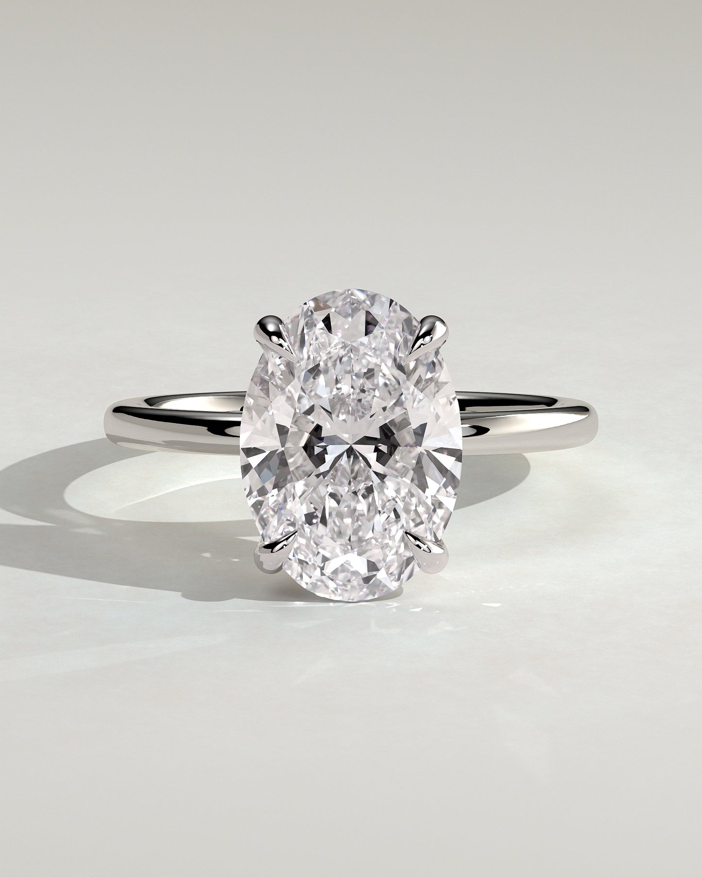 Daisy - Classic Oval Claw Solitaire Engagement Ring - Platinum