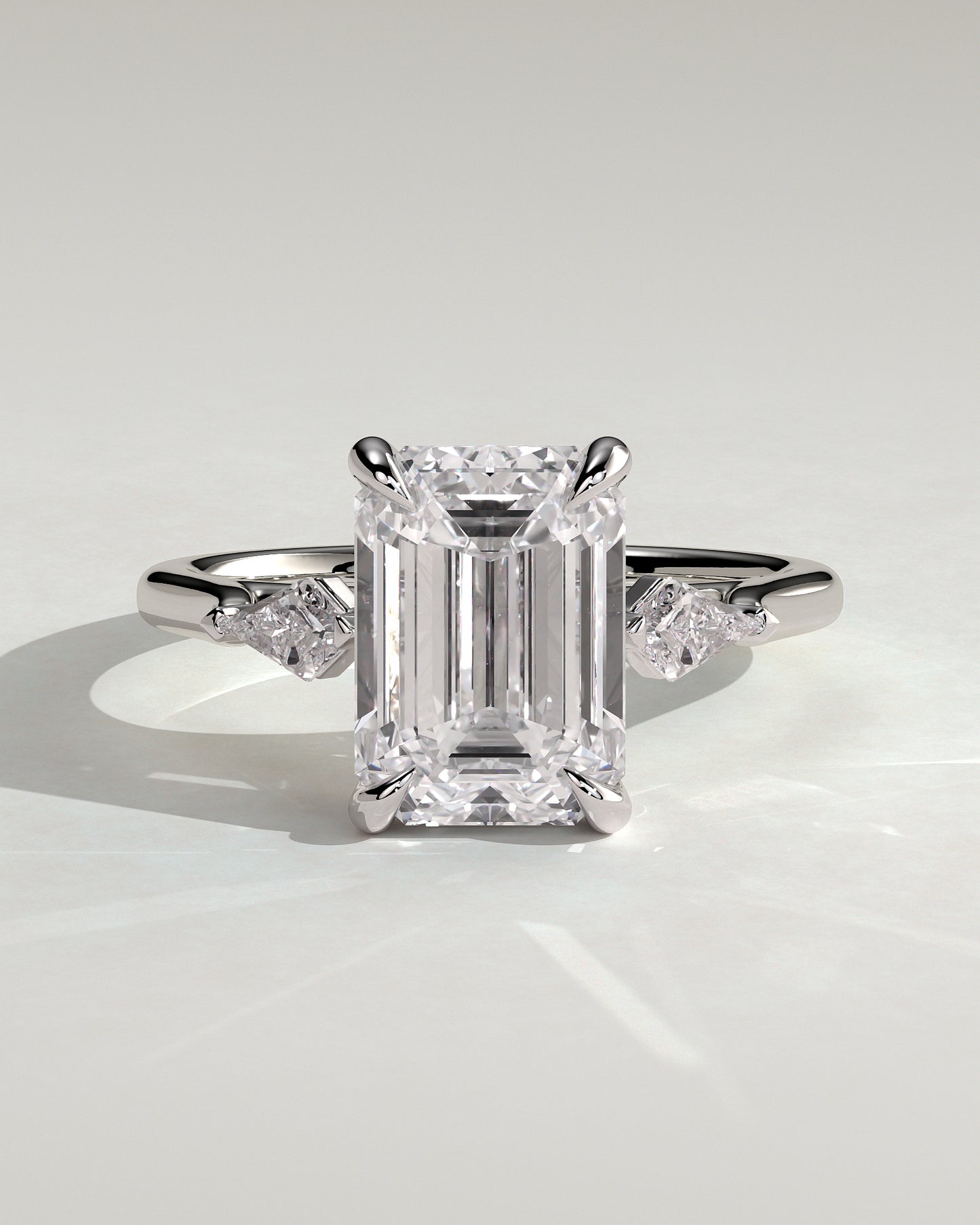 Elphie - Emerald Claw Trilogy with Kite Side Stones Engagement Ring - Platinum