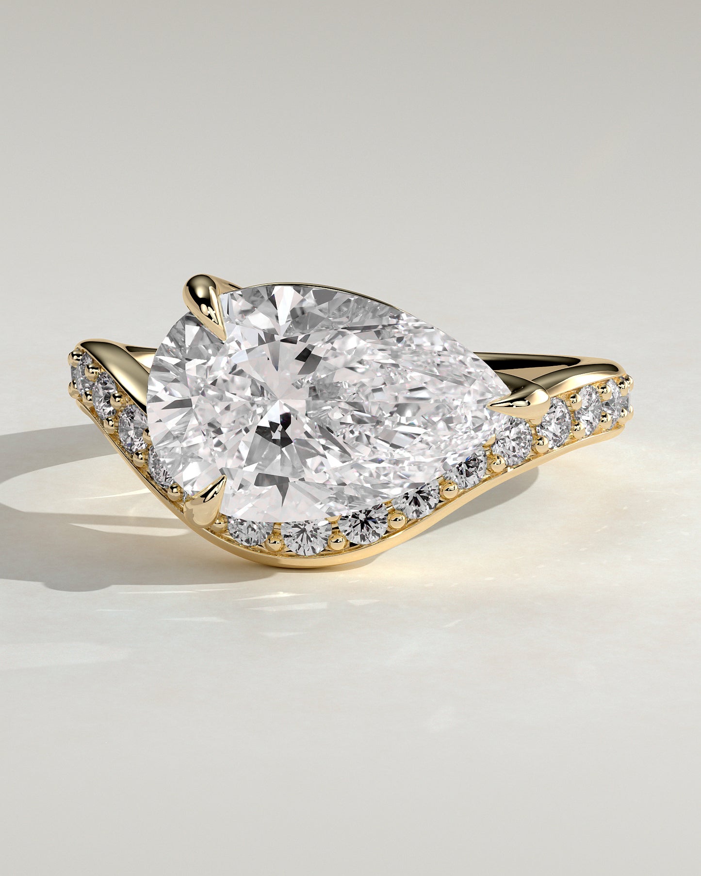 Eliza - Pear Claw Solitaire with Bead Set Pave Wave Band and East West Setting Engagement Ring - Yellow Gold