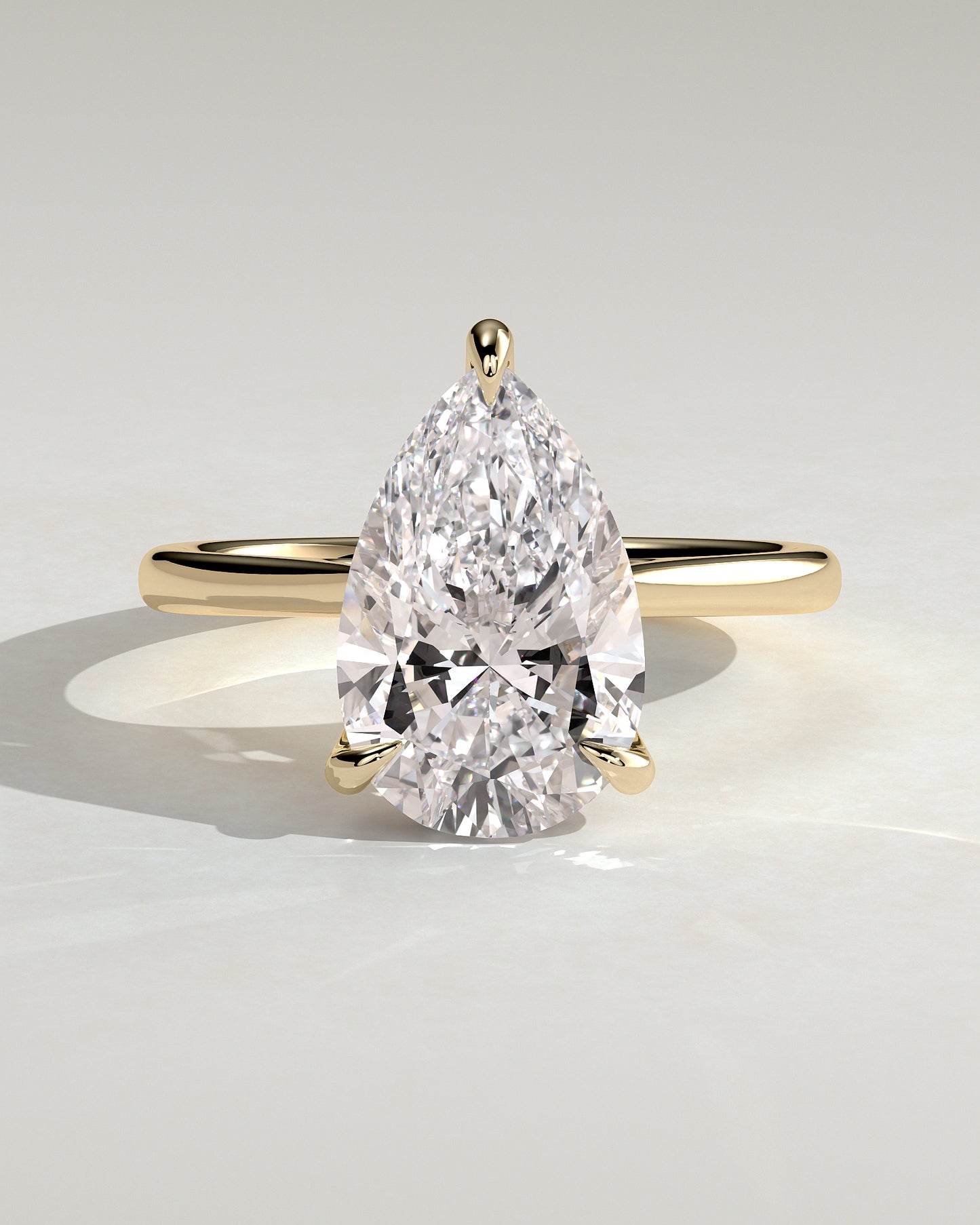 Courtney - Pear Claw Solitaire with Hidden Halo, Tapered Band and Cathedral High Setting Engagement Ring - Yellow Gold