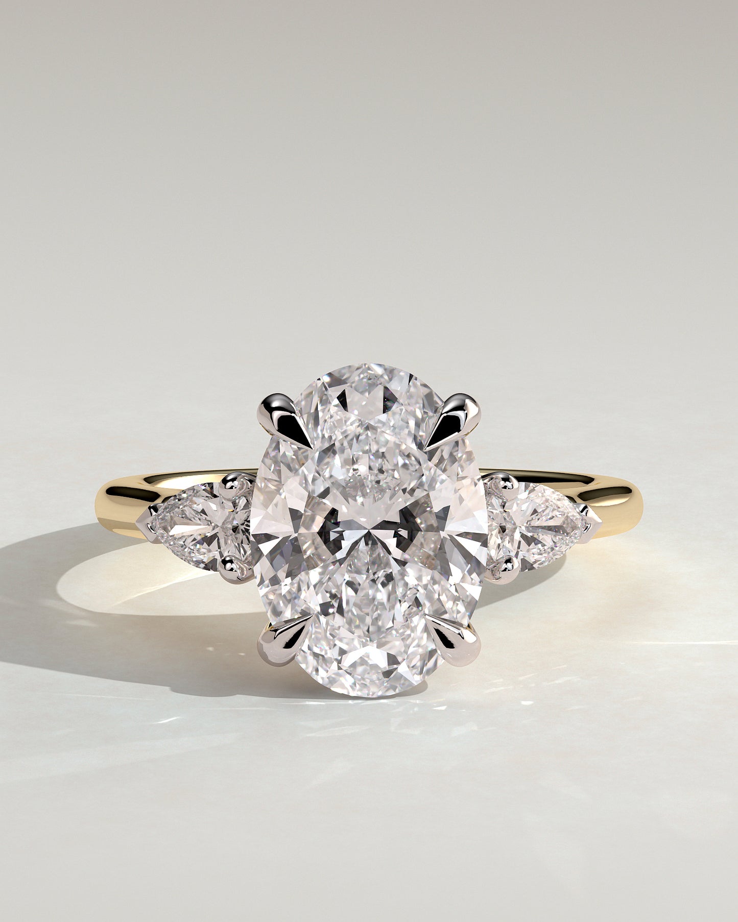 Alexia - Oval Claw Trilogy with Pear Side Stones and Cathedral Setting Engagement Ring - Yellow Two-Tone