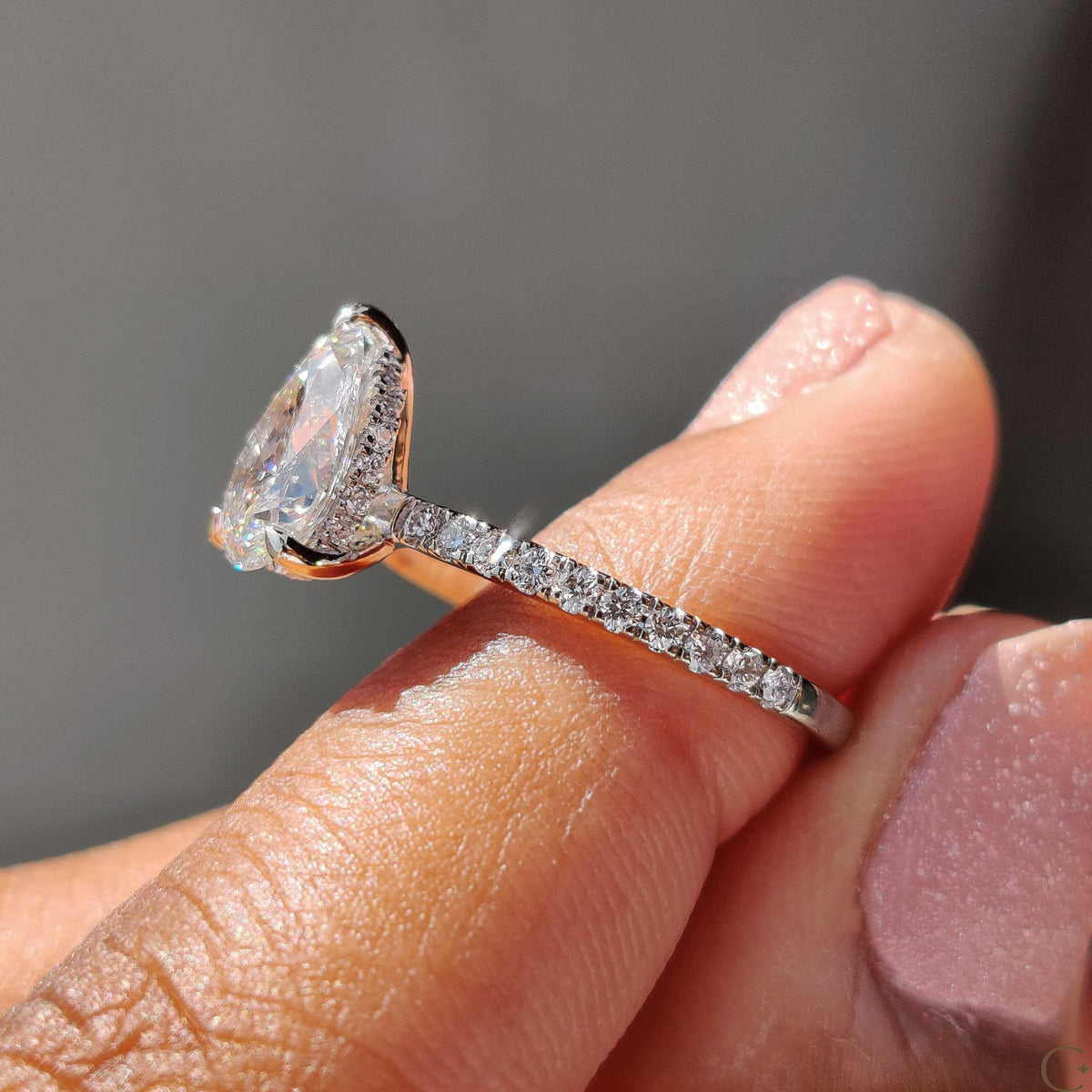 Pear Cut Engagement Ring With Hidden Halo Design