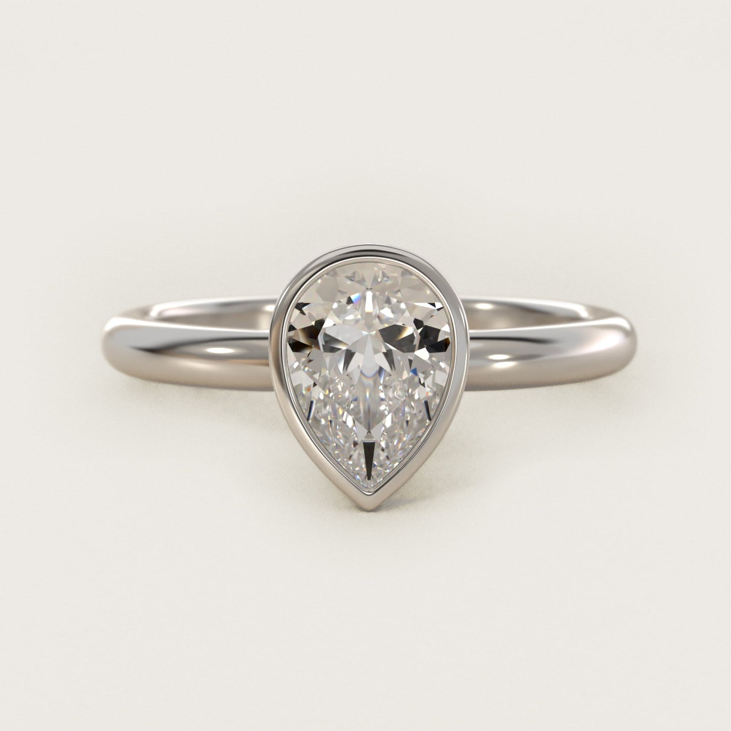 Bezel Solitaire Engagement Ring in Platinum - Pear Center