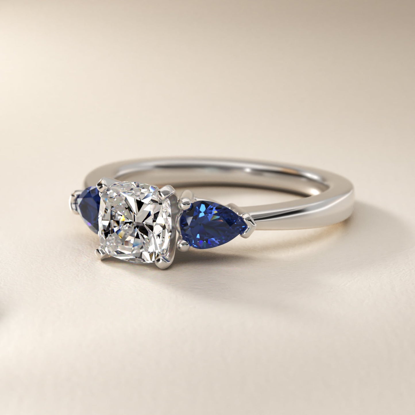Classic Pear Shaped Sapphire Engagement Ring in Platinum - Cushion Center