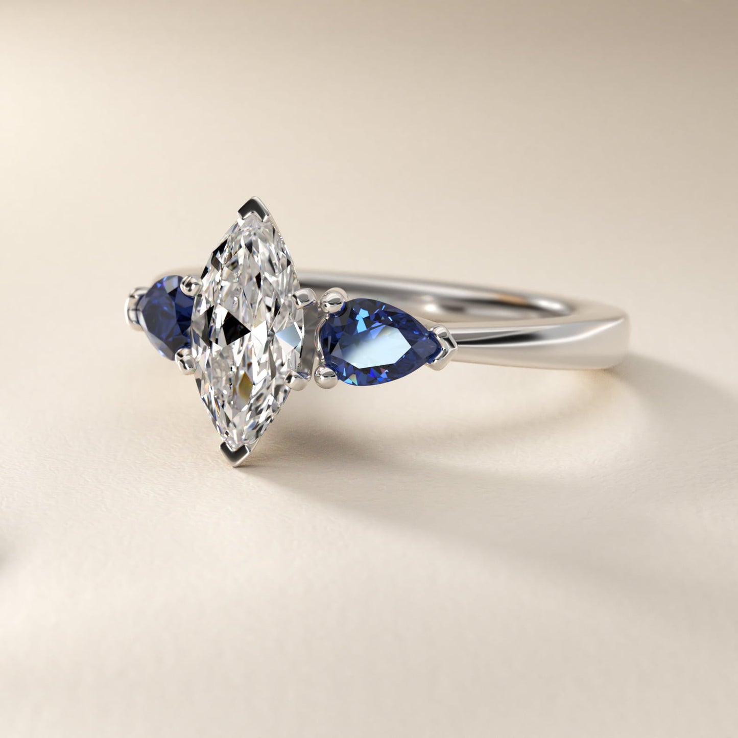 Classic Pear Shaped Sapphire Engagement Ring in Platinum - Marquise Center