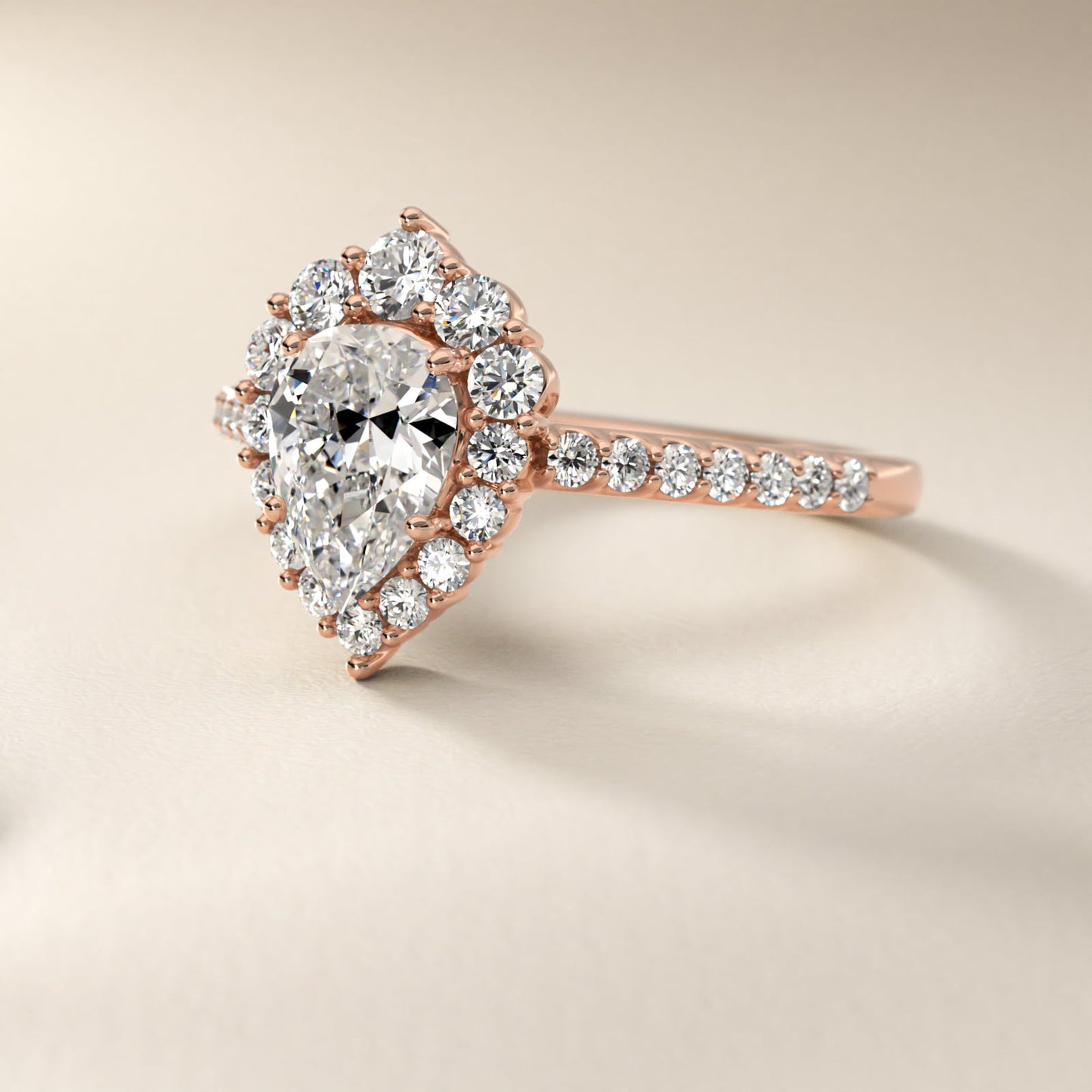 Graduated Diamond Halo Engagement Ring In 14K Rose Gold By James Allen - Pear Center
