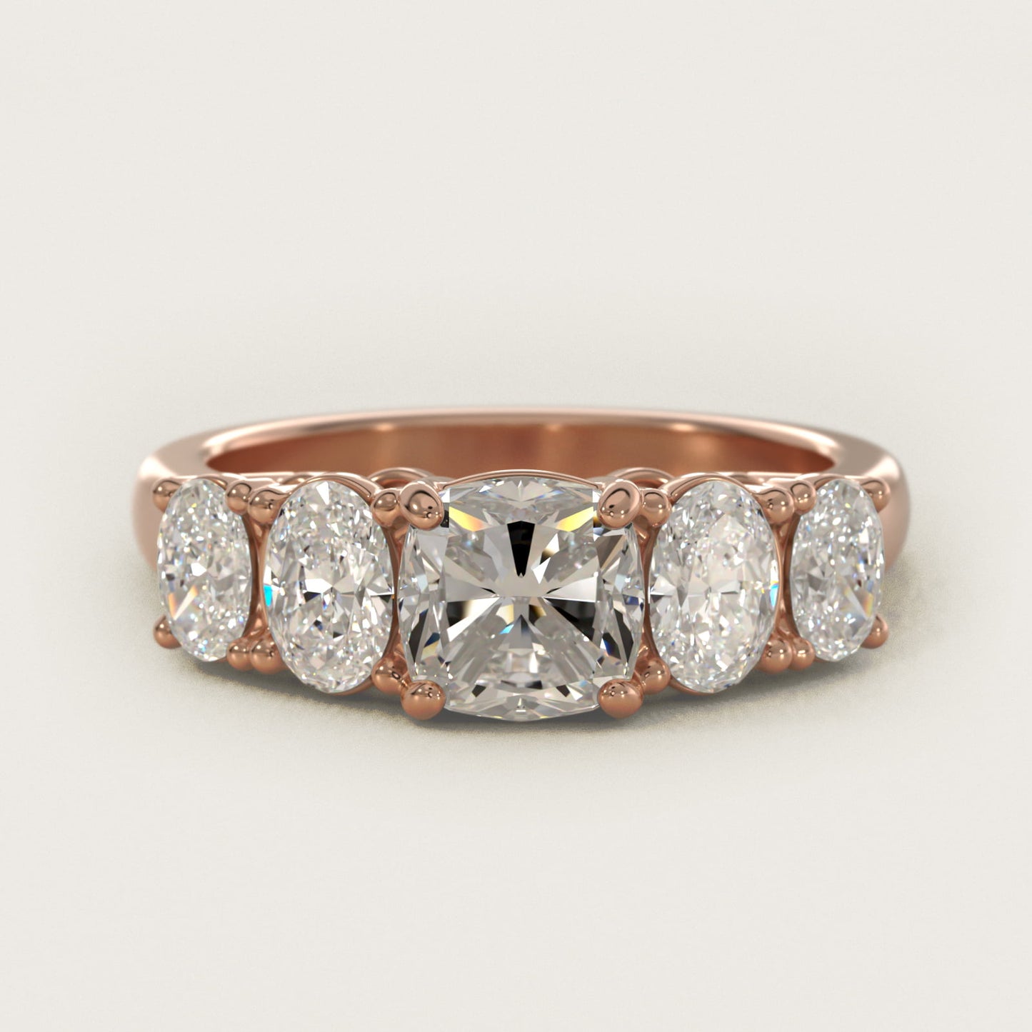 Graduated Oval Diamond Engagement Ring in 14k Rose Gold (1/2 ct. tw.) - Cushion Center