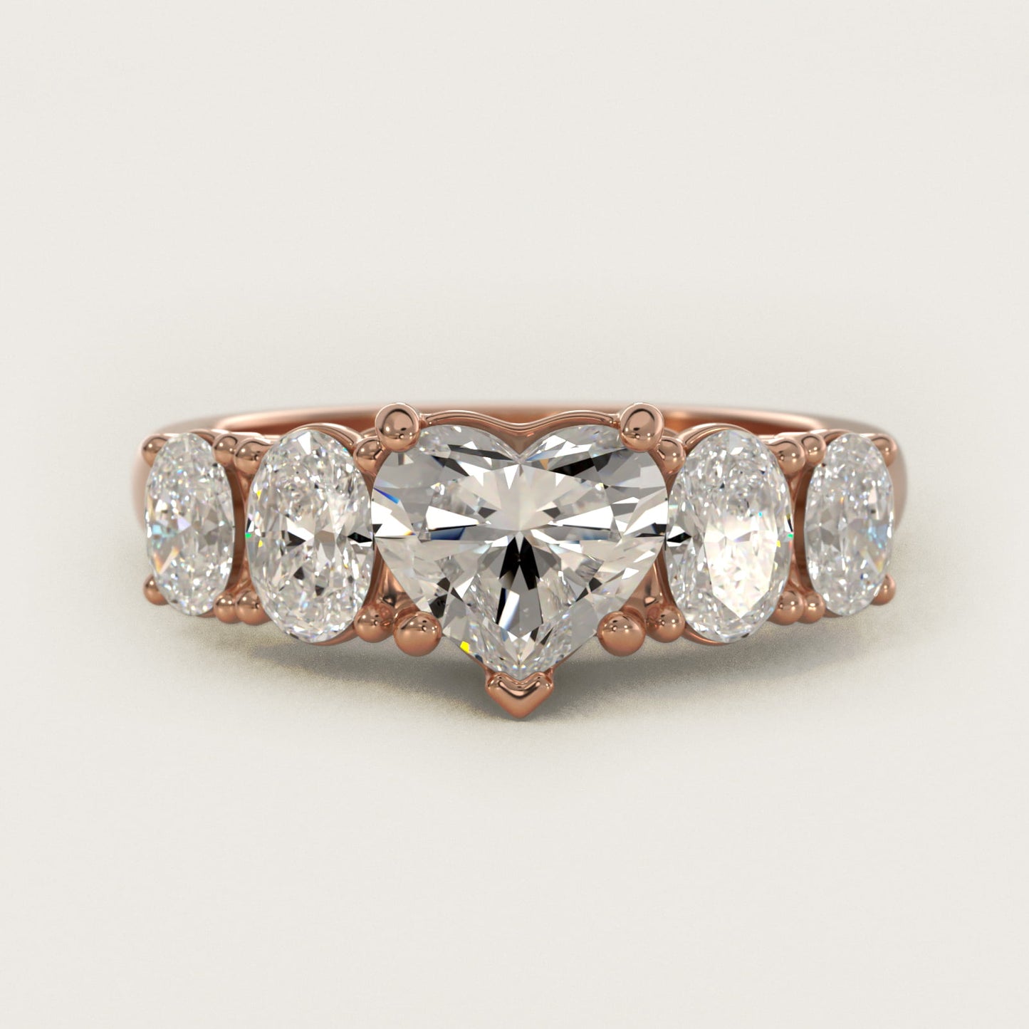 Graduated Oval Diamond Engagement Ring in 14k Rose Gold (1/2 ct. tw.) - Heart Center