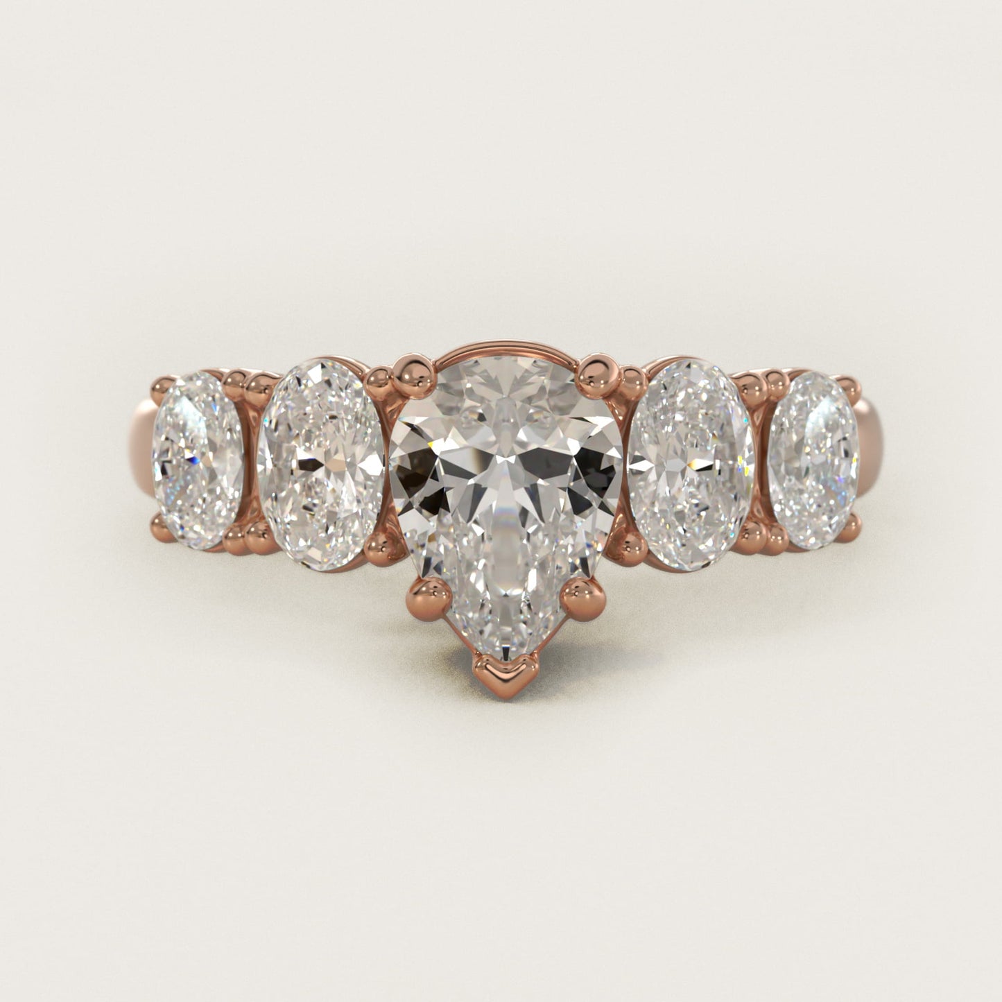 Graduated Oval Diamond Engagement Ring in 14k Rose Gold (1/2 ct. tw.) - Pear Center