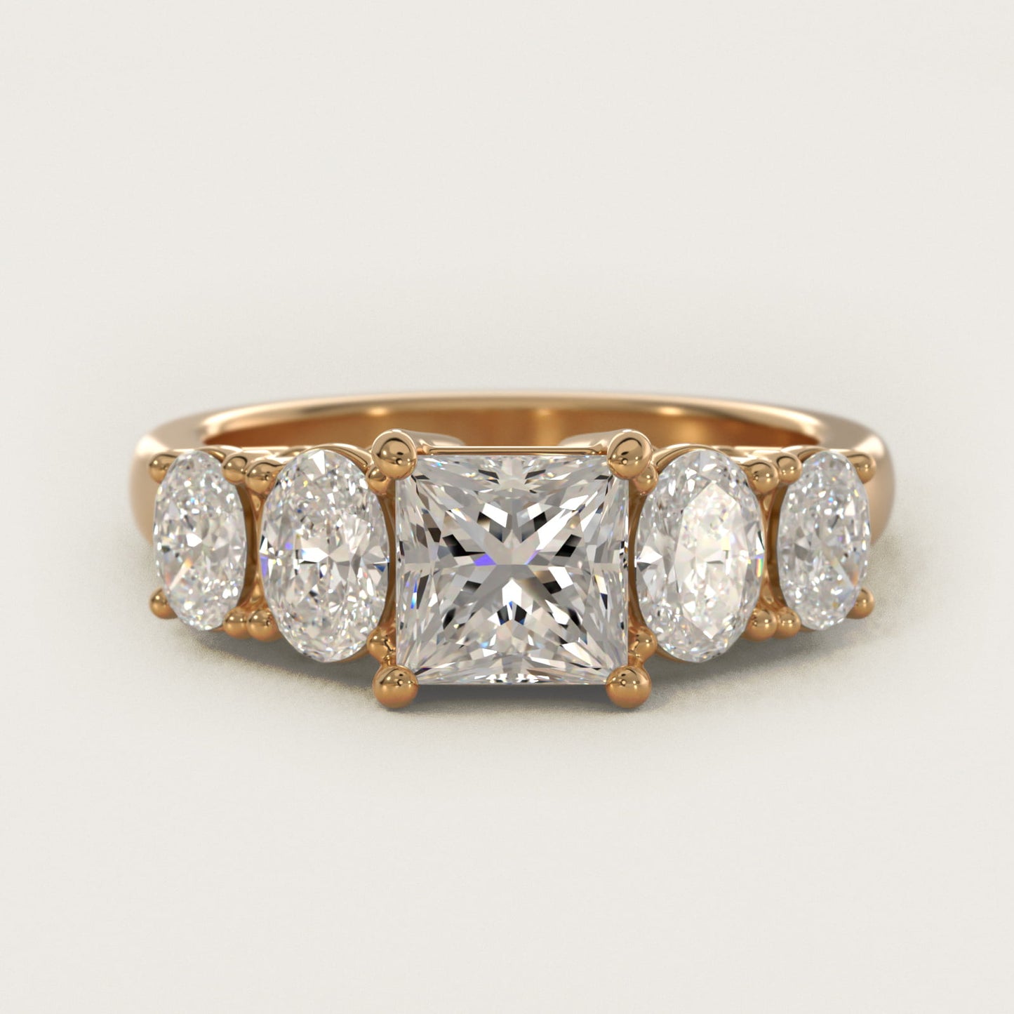 Graduated Oval Diamond Engagement Ring in 14K Yellow Gold (1/2 ct. tw.) - Princess Center