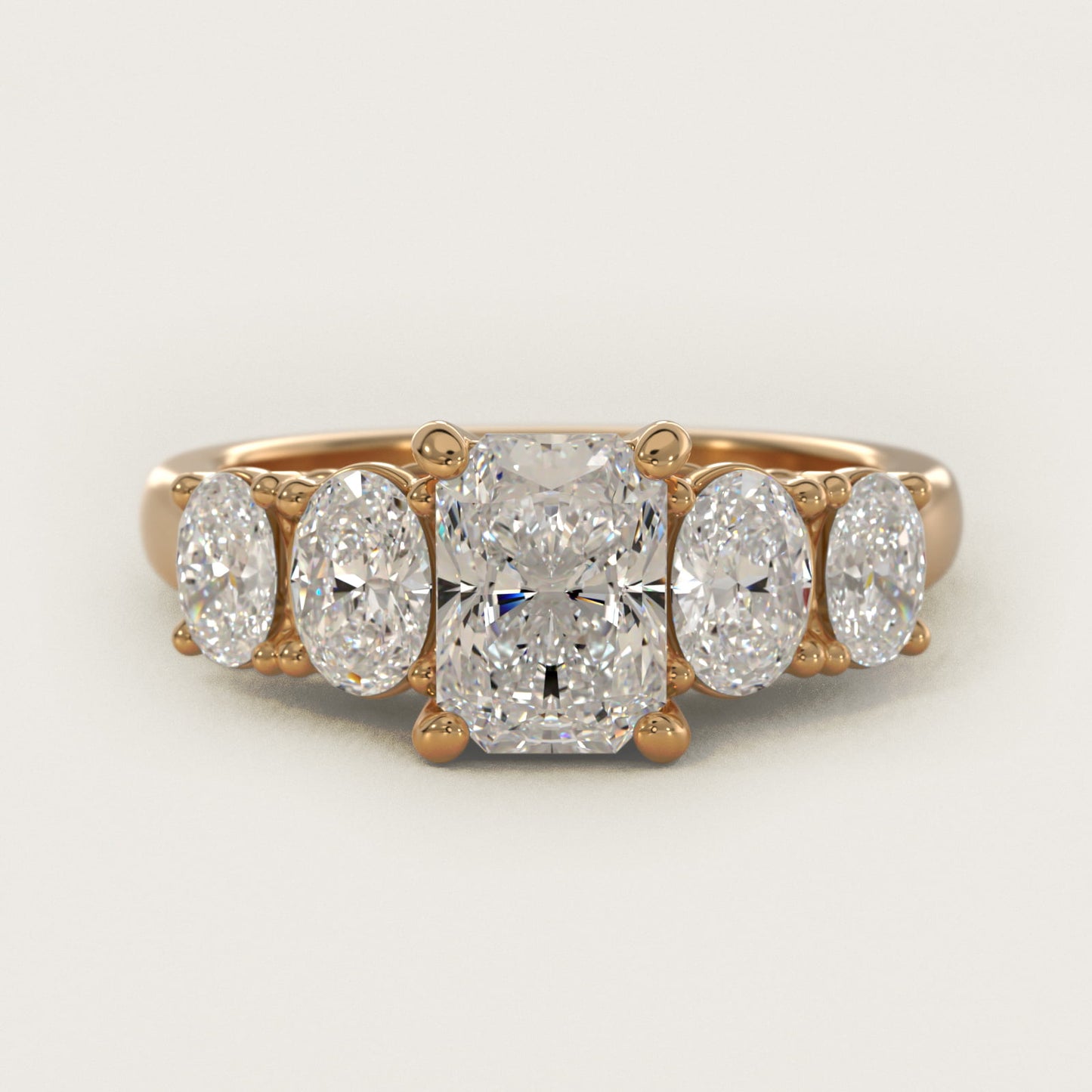Graduated Oval Diamond Engagement Ring in 14K Yellow Gold (1/2 ct. tw.) - Radiant Center