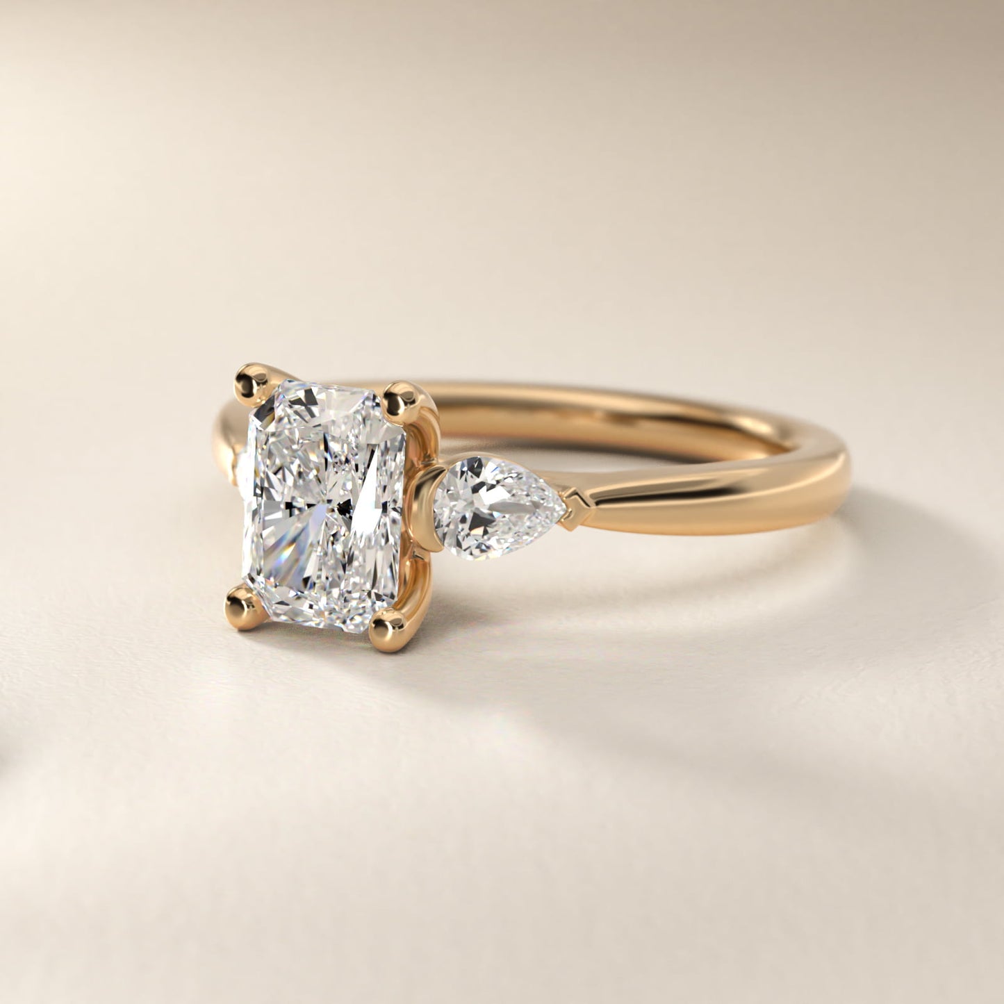 Pear Sidestone Diamond Engagement Ring in 14k Yellow Gold (1/4 ct. tw.) - Radiant Center