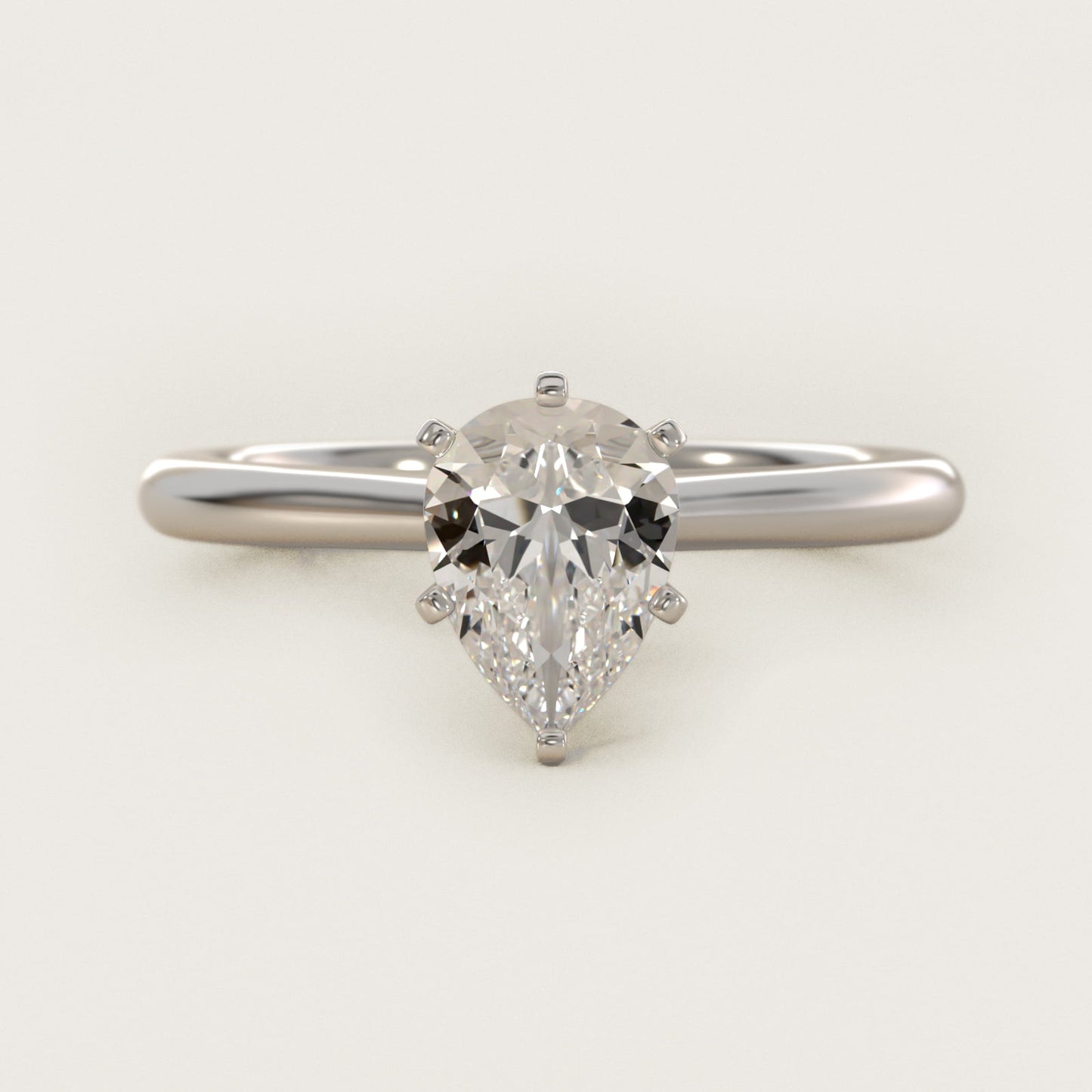 Petite Solitaire Engagement Ring in Platinum - Pear Center