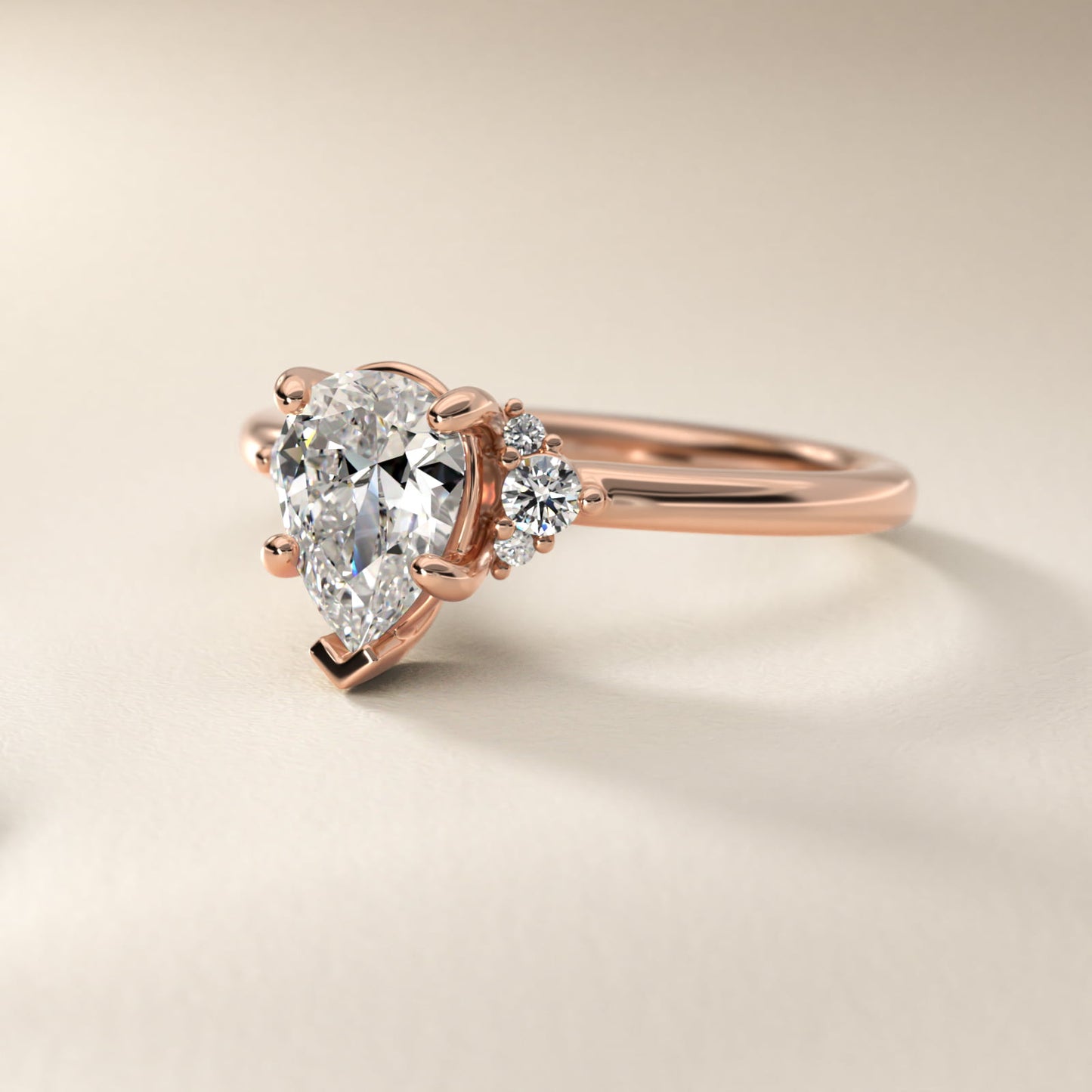 Petite Three Diamond Engagement Ring in 18k Rose Gold (1/10 ct. tw.) - Pear Center