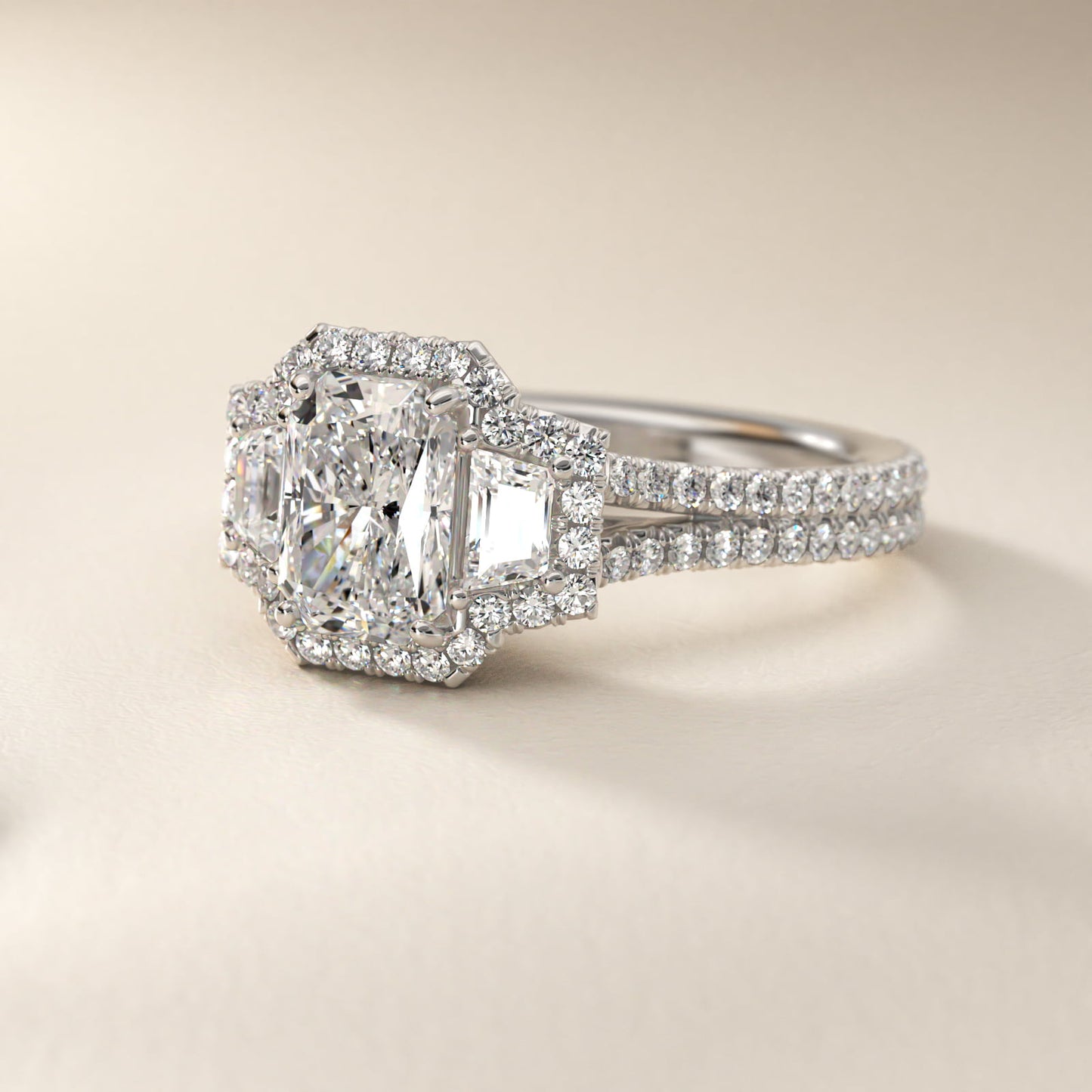 The Gallery Collection™ Emerald Three Stone Halo Diamond Engagement Ring in Platinum - Radiant Center