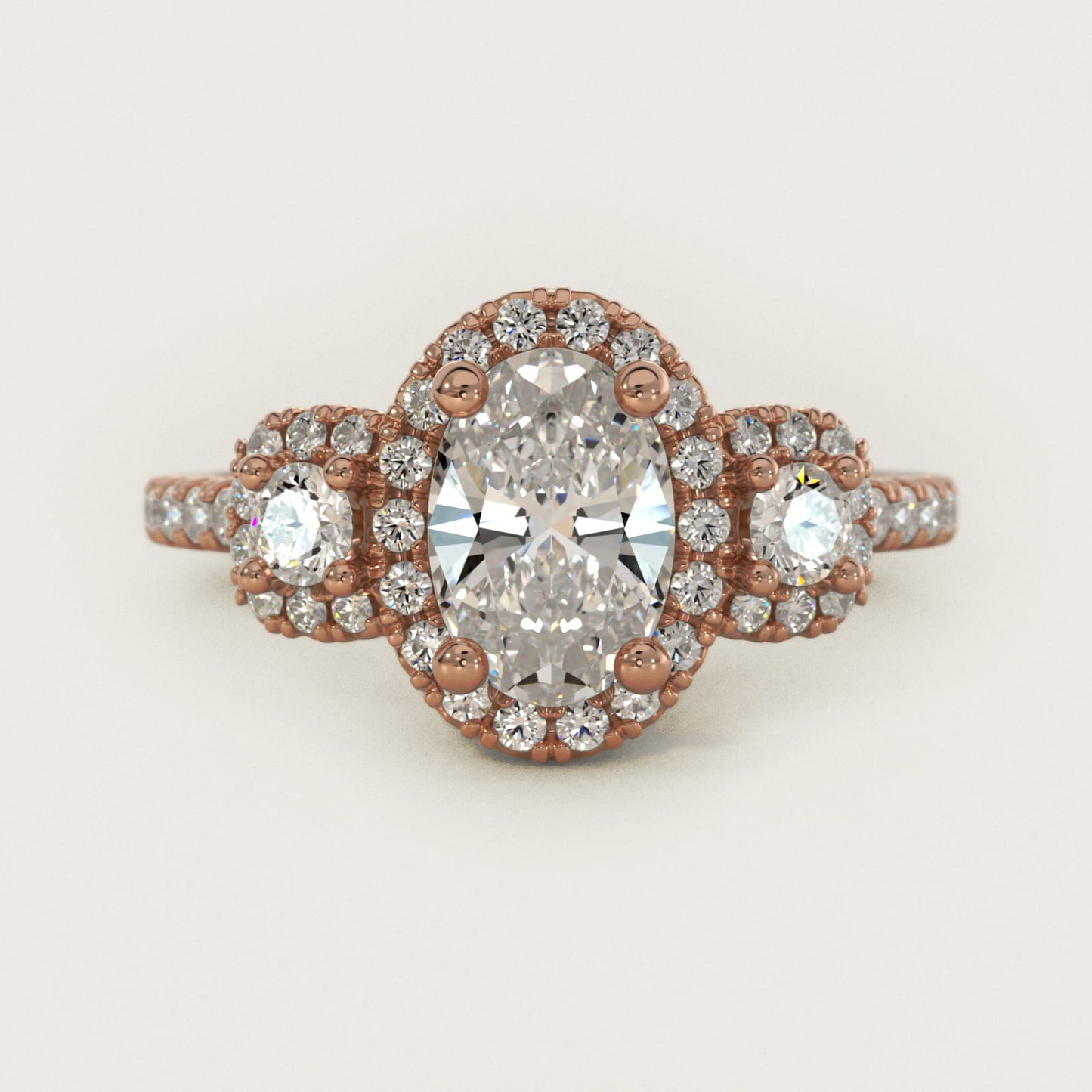 Three-Stone Cushion Halo Diamond Engagement Ring in 14k Rose Gold - Oval Center
