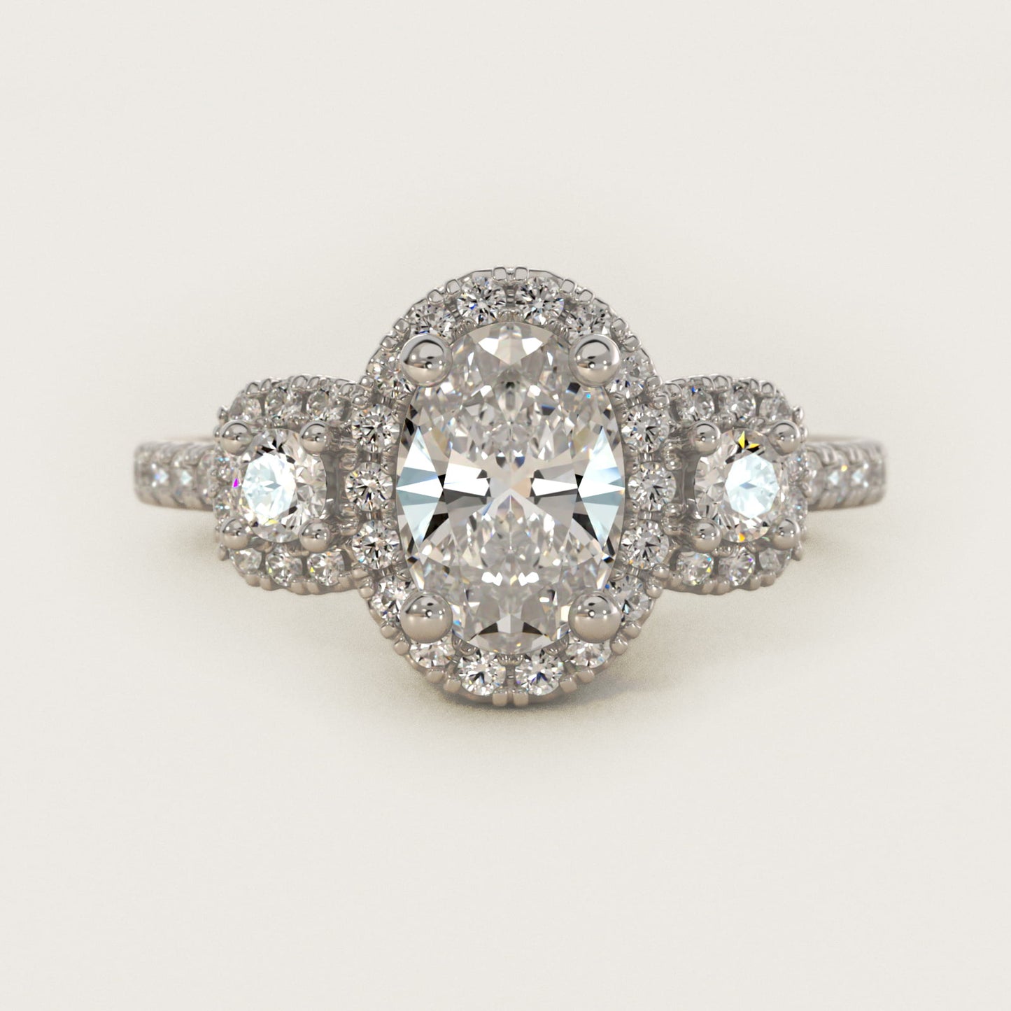 Three-Stone Cushion Halo Diamond Engagement Ring in Platinum - Oval Center