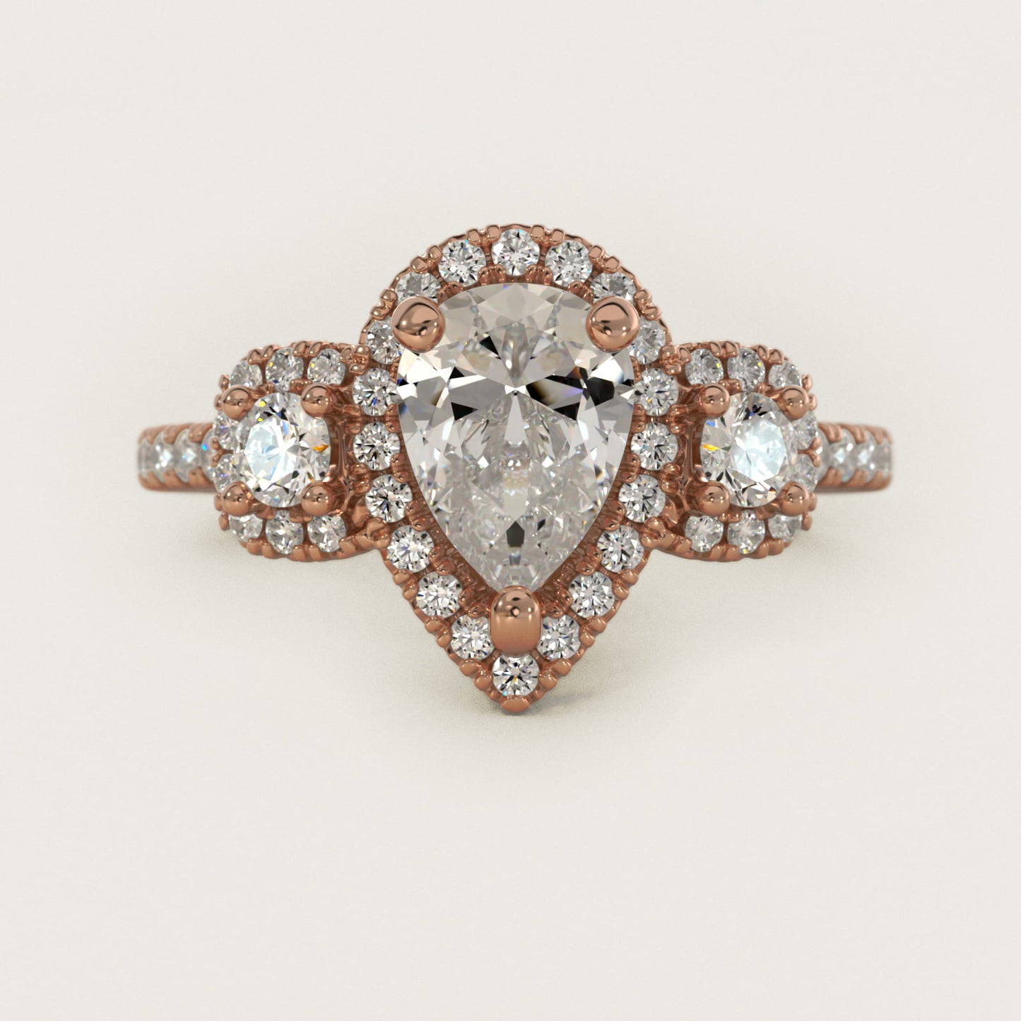 Three-Stone Cushion Halo Diamond Engagement Ring in 14k Rose Gold - Pear Center