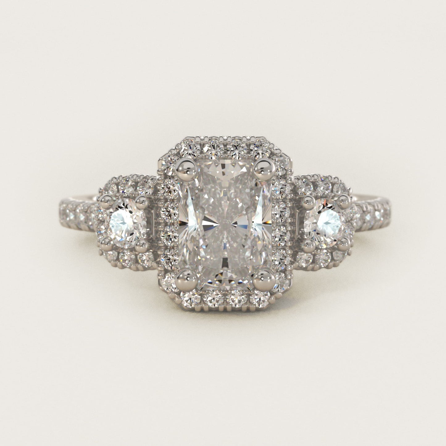 Three-Stone Cushion Halo Diamond Engagement Ring in Platinum - Radiant Center
