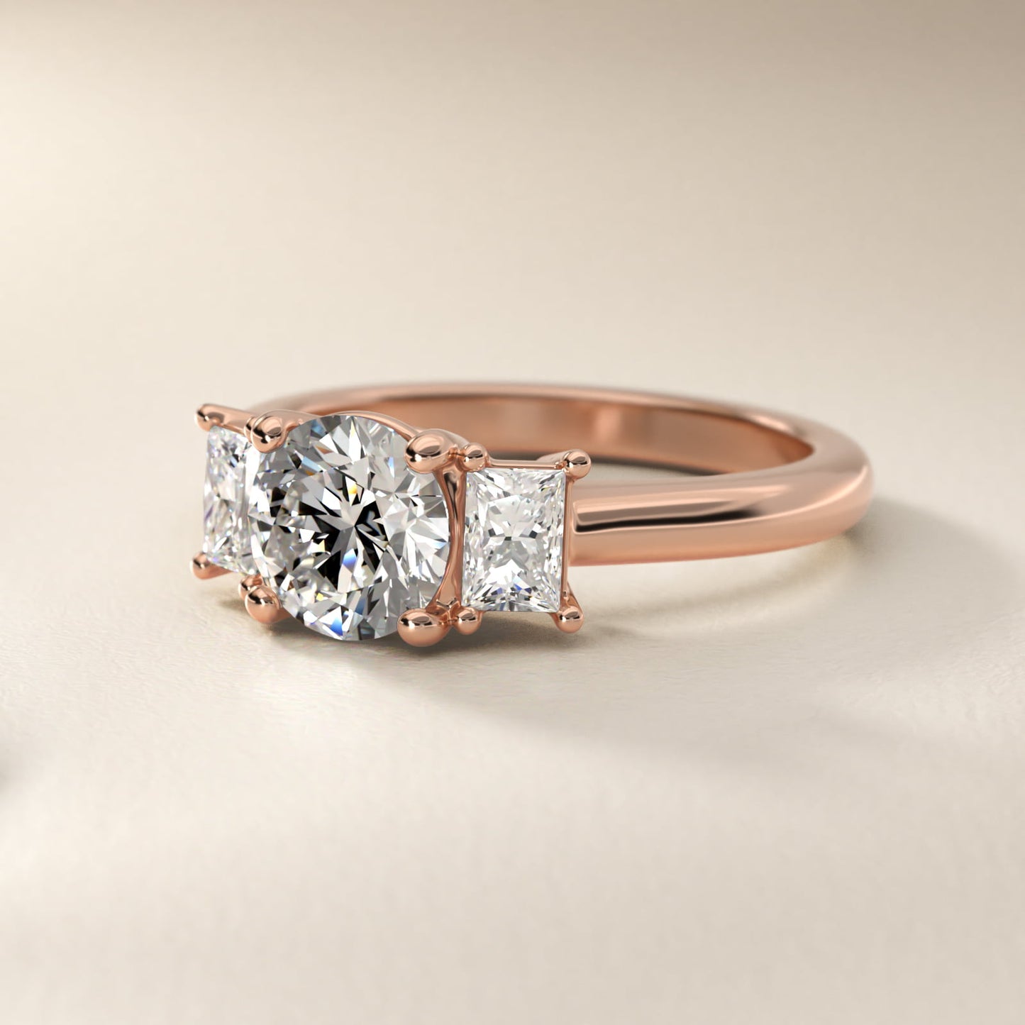 Three-Stone Elongated Princess Diamond Engagement Ring in 18k Rose Gold (1/2 ct. tw.) - Round Center