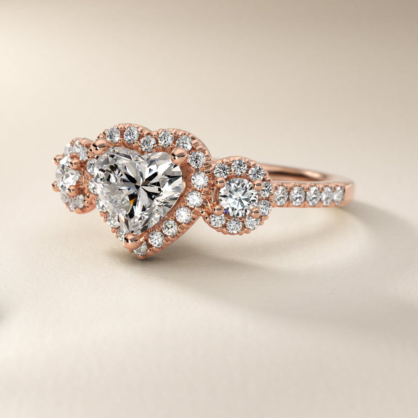 Three-Stone Halo Diamond Engagement Ring in 14k Rose Gold - Heart Center
