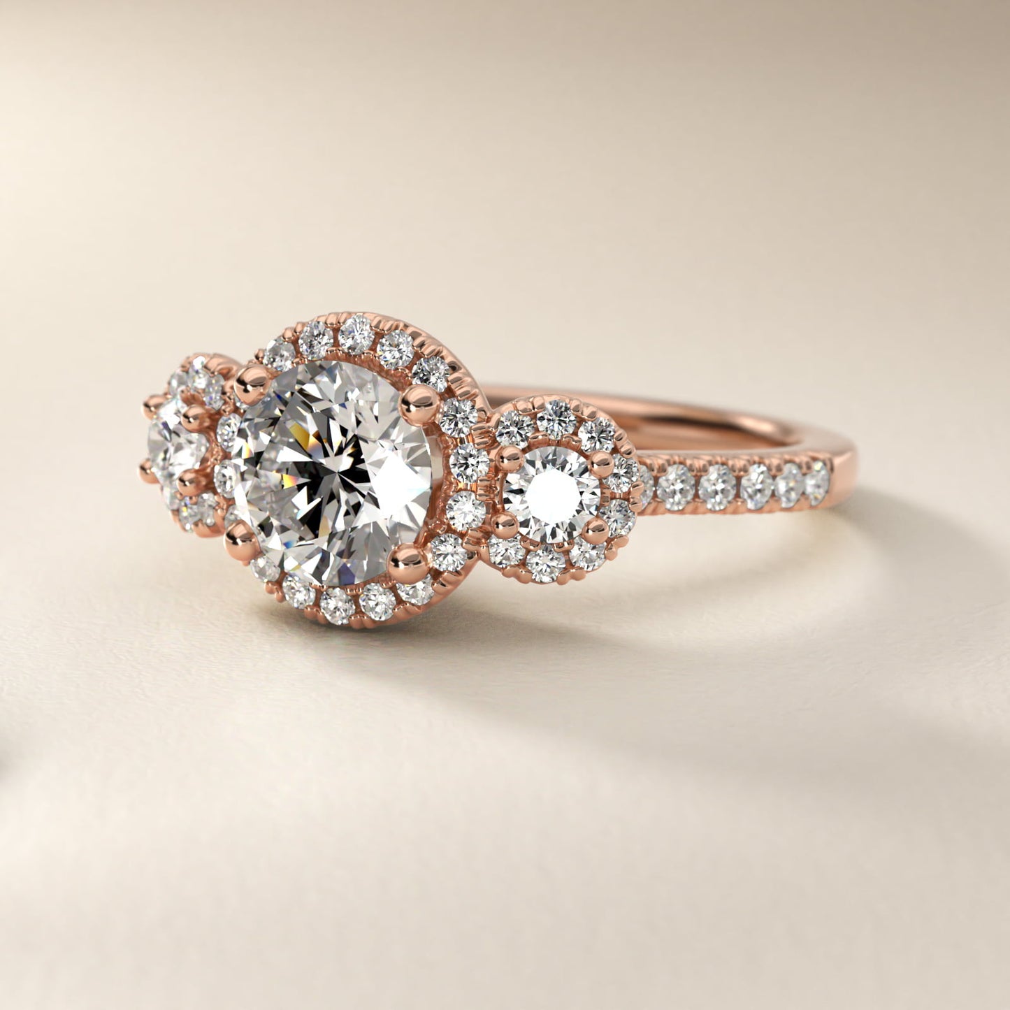 Three-Stone Halo Diamond Engagement Ring in 18k Rose Gold - Round Center