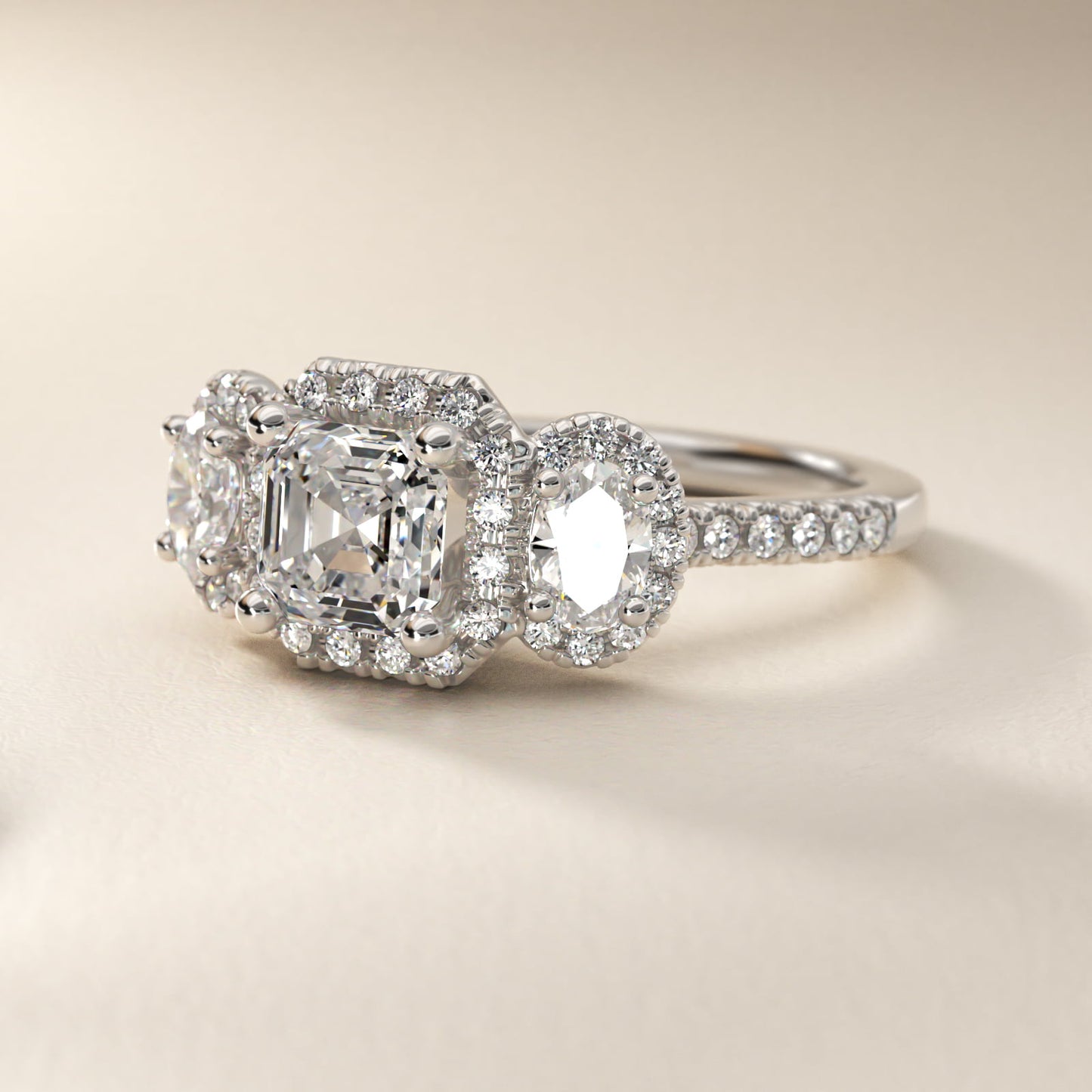 Three-Stone Oval Halo Diamond Engagement Ring in Platinum - Asscher Center