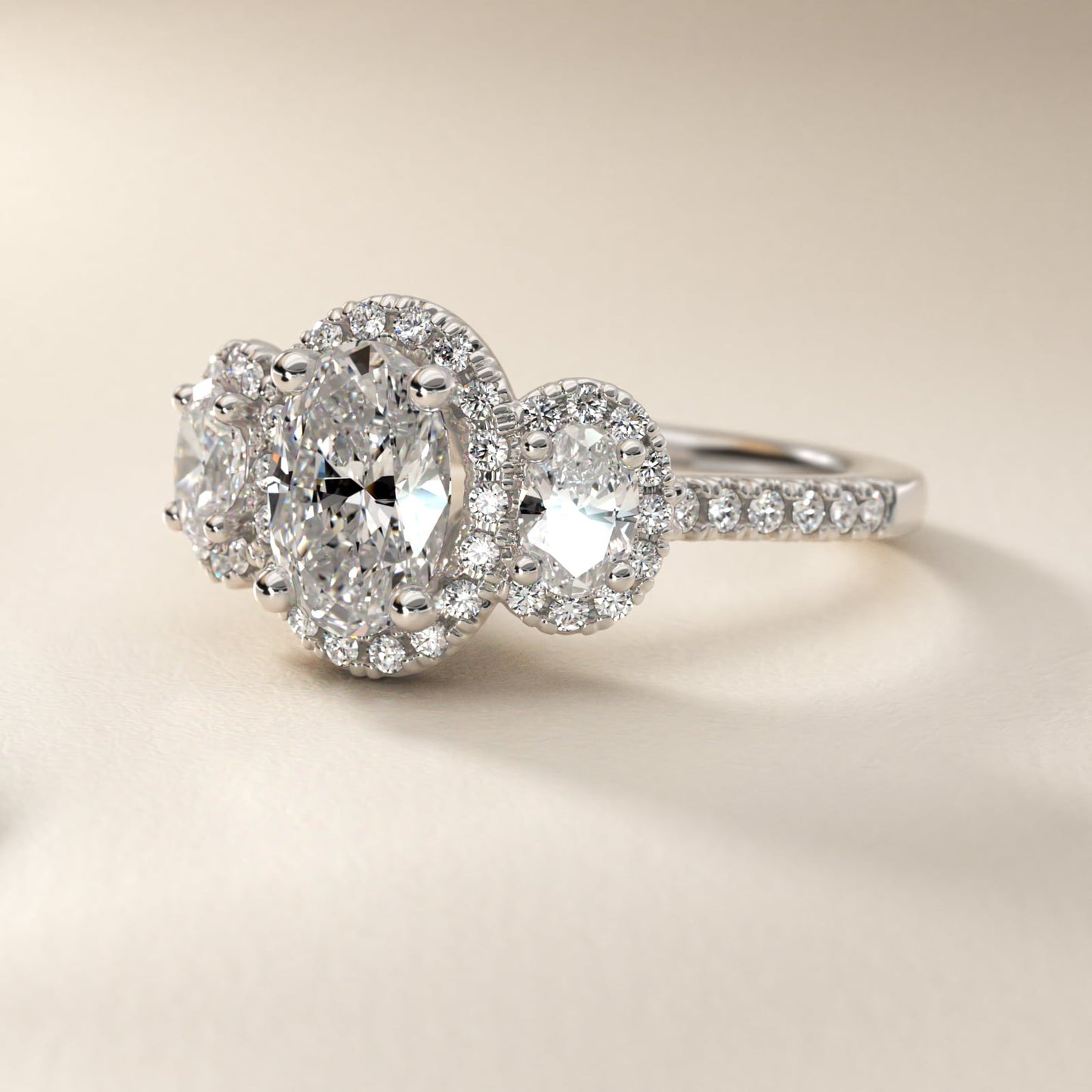 Three-Stone Oval Halo Diamond Engagement Ring in Platinum - Oval Center