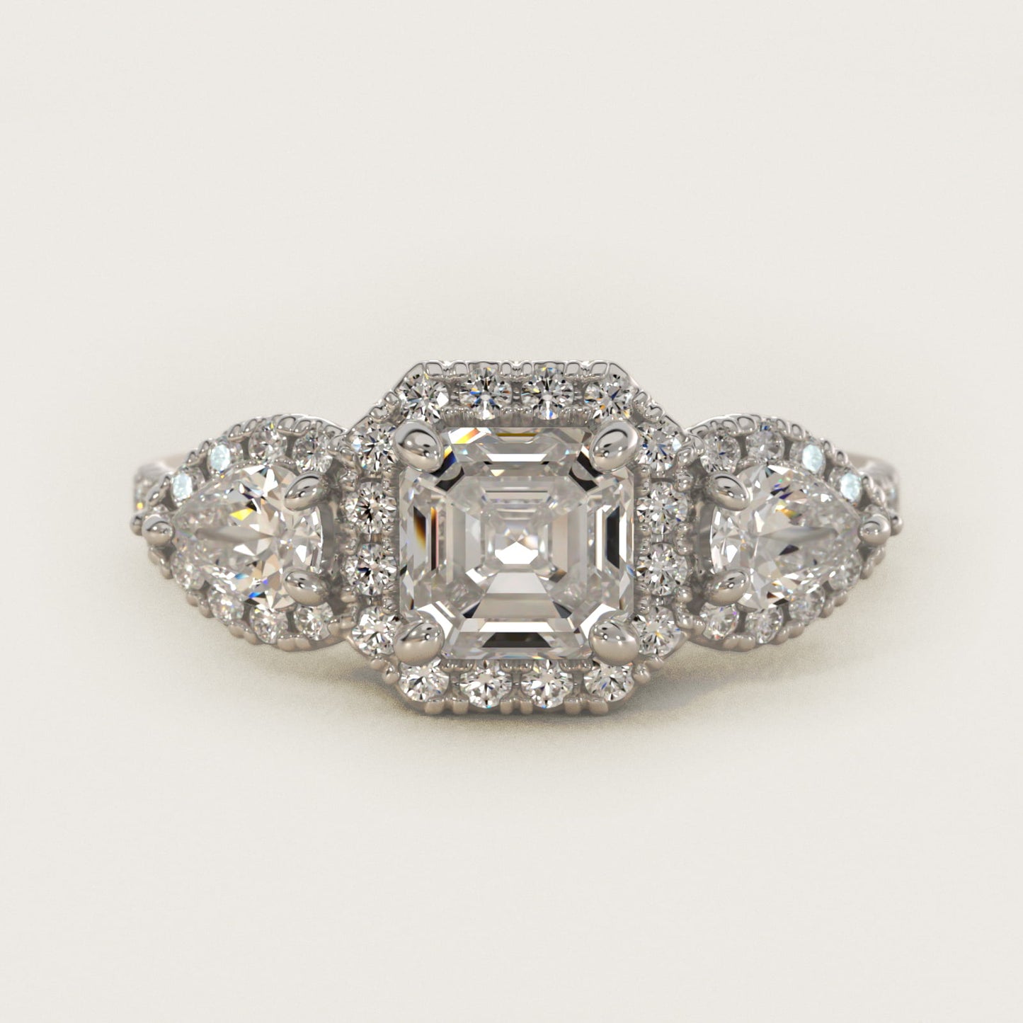 Three-Stone Pear Halo Diamond Engagement Ring in Platinum - Asscher Center