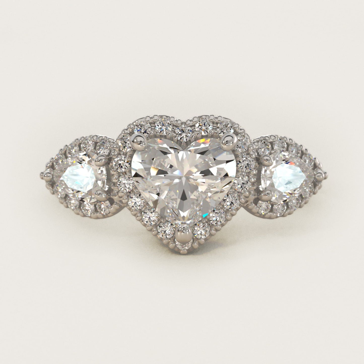 Three-Stone Pear Halo Diamond Engagement Ring in Platinum - Heart Center