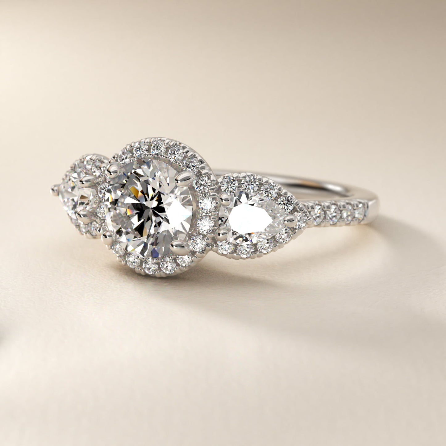 Three-Stone Pear Halo Diamond Engagement Ring in 18k White Gold - Round Center