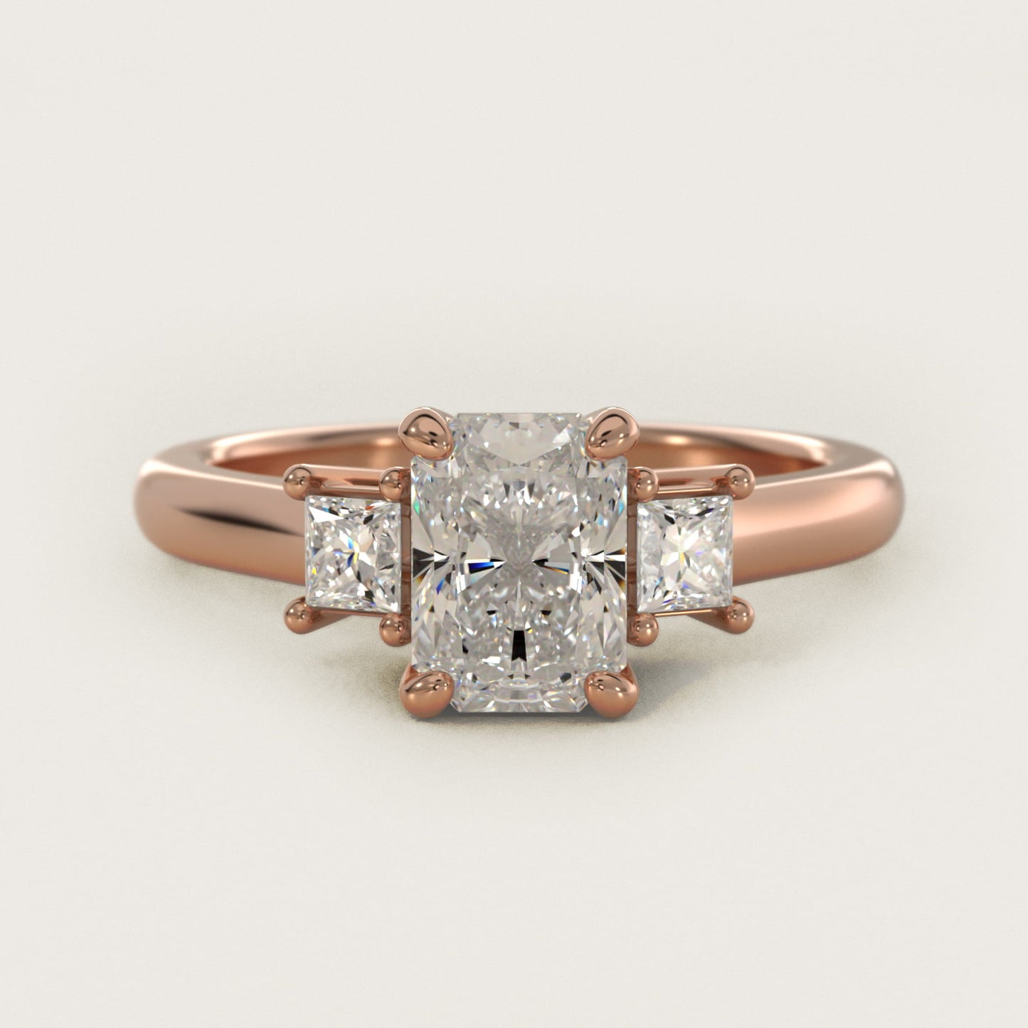 Three-Stone Princess Diamond Engagement Ring in 18k Rose Gold (1/3 ct. tw.) - Radiant Center