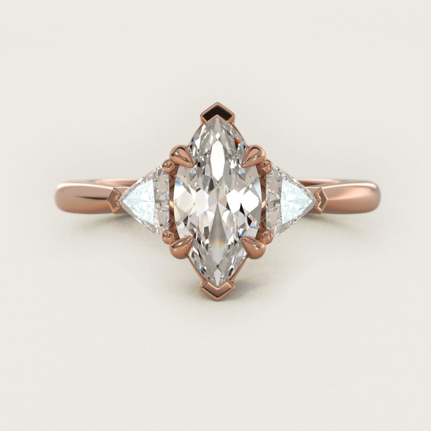Three-Stone Trillion Diamond Engagement Ring in 14k Rose Gold (1/3 ct. tw.) - Marquise Center