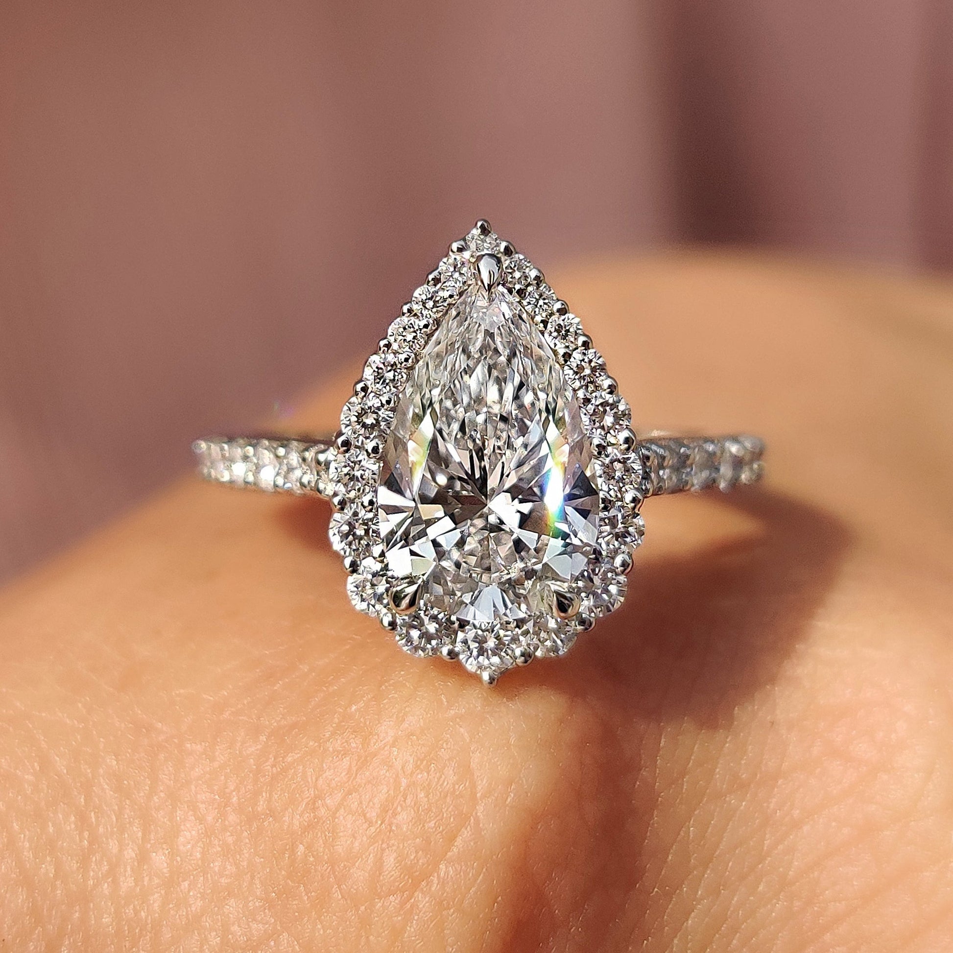 Pear Shaped Halo Engagement Ring In Round Cut Halo Style