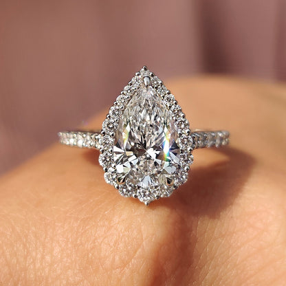 Pear Shaped Halo Engagement Ring In Round Cut Halo Style