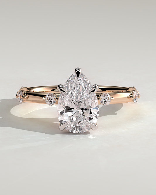Amora - Pear Claw Solitaire with 6 Spaced Round Accent Stones and Hidden Halo Engagement Ring - Rose Two-Tone