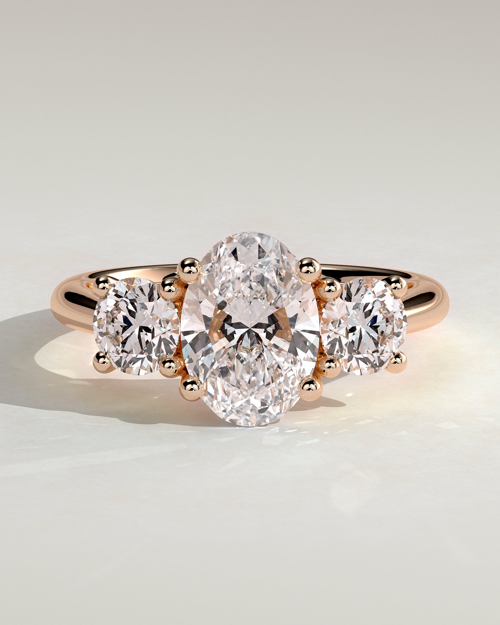 Grace - Oval Claw Trilogy with Round Side Stones, Open Trellis Gallery and Tapered Band Engagement Ring - Rose Gold - Rose Gold 2ct