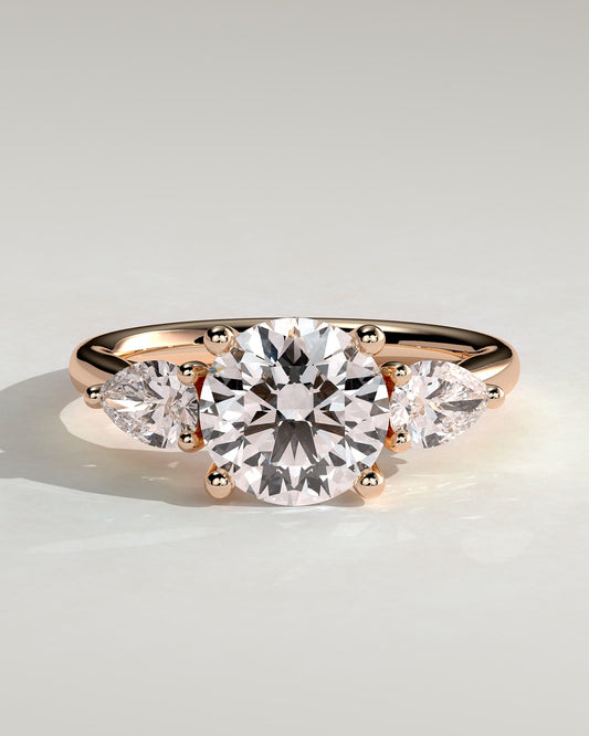 Adelyn - Round Claw Trilogy with Pear Side Stones and Open Trellis Gallery Engagement Ring - Rose Gold - rose gold - Lara Jewels