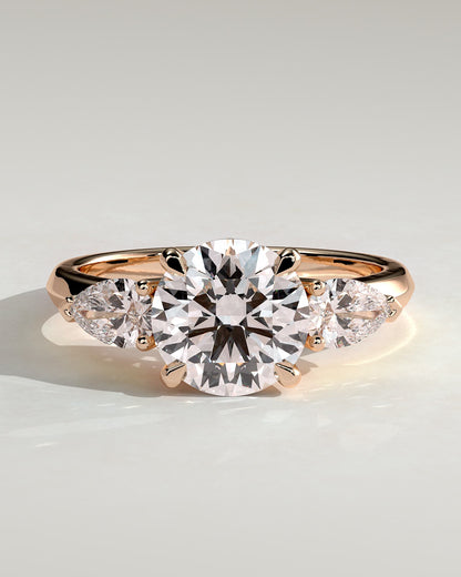 Halle - Round Claw Trilogy with Pear Side Stones and Knife Edge Band Engagement Ring - Rose Gold