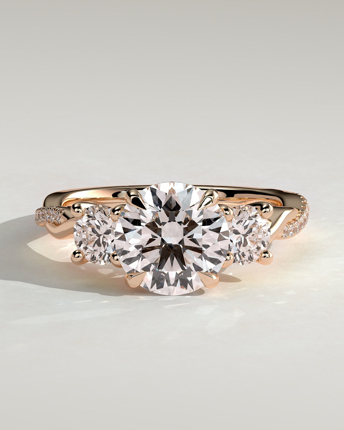 Jaylene - Round Claw Trilogy with Round Side Stones, Twisted Pave Band and Trellis Gallery Engagement Ring - Rose Gold