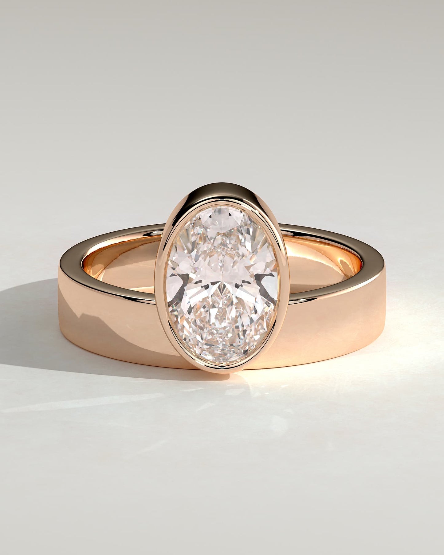 Carmen - Oval Bezel Solitaire with Offset Setting and Flat Cigar Band Engagement Ring - Rose Gold